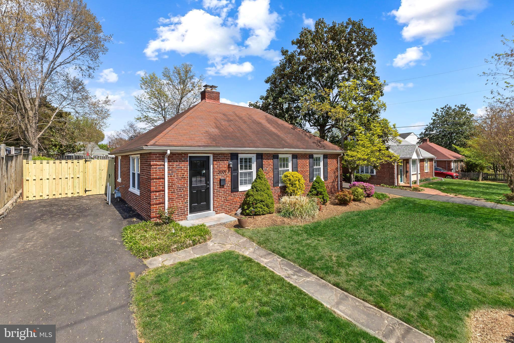 Ideal one-level living with private flat backyard!! Located just over a mile from King St Metro and the heart of Old Town, this home was thoughtfully expanded and offers the perfect blend of charm, comfort, and convenience. Enjoy 1,286 sq ft of living space, three bedrooms and two beautifully updated full baths - ALL on one level! The inviting living room offers space for a dining area, a cozy wood-burning fireplace, and plantation shutters for added character. The updated kitchen is equipped with KitchenAid appliances and provides direct access to the back patio and large fenced yard—ideal for indoor to outdoor dining and entertaining. The spacious primary suite is a true retreat with a vaulted ceiling, plenty of space for a King bed, two closets, an en suite bath with a marble shower and Restoration Hardware vanity, and sliding glass doors leading to the patio and backyard. Huge laundry room with tons of storage and sliding barn doors. Two additional bedrooms, a second full bath with tub shower and large linen closet in the hall.  Fresh neutral paint, gorgeous wood floors and window treatments throughout.  Retreat to the incredibly rare flat fenced backyard and gardens for peace and quiet or entertain guests on the back patio. Driveway parking for 2-3 cars. Hot Water Heater (2024); Trane HVAC (2015); double pane windows.  Unbeatable location for commuting with easy access to I-395 and bus stop across the street. Less than a mile to Bradlee Shopping Center where you'll find grocery stores, restaurants, convenience stores, exercise studios and more! Stroll to Chinquapin Park playground and trail. Incredible opportunity to own a detached, move-in ready home in Alexandria City!