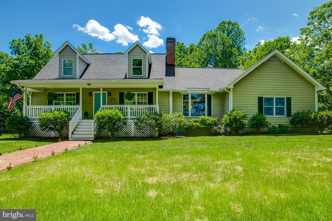 Gorgeous Cape Cod on 4+ acres close to town yet extremely private.  In ground salt water pool and separate hot tub. Front and back porches. Fenced back yard. Paved circular driveway with side load garage.  Main level master bedroom with large master bath that leads to back porch and pool area. Gourmet kitchen with family room and fireplace with built in bookcases. Formal living and dining areas. 2 large bedrooms on upper level with full updated bath. Lower level can be in law suite or separate appt.  It has a kitchen, bath, living area and full bedroom.  Also in lower level is  a computer or craft room and storage area.  Pool is a salt water pool with pool house and hot tub.  This house has it all.
