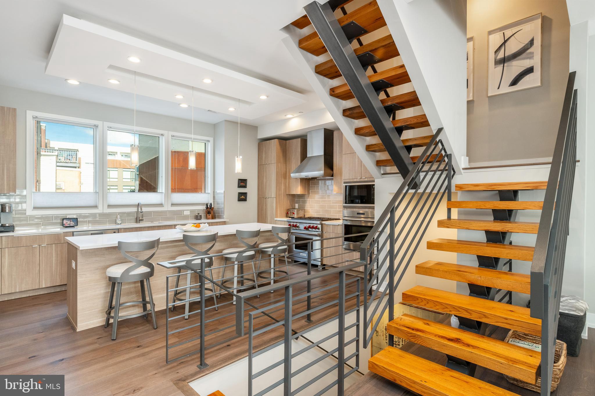 Immerse yourself in the pinnacle of luxury living at 605 N Galloway Street, nestled within the charming and booming Northern Liberties neighborhood of Philadelphia. This stunning townhouse is a masterpiece of design, boasting an extra-wide open floor plan and meticulous attention to detail, where no expense has been spared in the thoughtful finishes, a 2 CAR GARAGE and APPROX 4 Years Left On The TAX ABATEMENT.

Step into sprawling, open spaces adorned with beautiful plank wood floors, exuding sophistication and elegance at every turn. The gourmet kitchen is a chef's delight, showcasing custom cabinetry and top-of-the-line Wolf and Sub-Zero appliances. A captivating fireplace infuses warmth and character, while the rooftop deck and balconies offer breathtaking views of the Ben Franklin Bridge and its surroundings.

This home is the epitome of luxurious living, seamlessly blending thoughtful architecture with lavish amenities. The sculptural open center stair defines the essence of open concept living, while multiple outdoor spaces provide serene spots for relaxation or enjoying your morning coffee.

The master level is a private retreat, featuring a versatile additional 5th bedroom perfect for a nursery, sitting room, second master closet, or office. Indulge in spa-like luxury in the master bathroom, boasting a large walk-in shower and oversized stand-alone soaking tub. Each bedroom is equipped with blackout shades, ensuring a peaceful night's rest.

Entertaining is a breeze with the pilot house boasting a wine fridge and sink, leading to a lovely roof deck  with a direct view of the Ben Franklin Bridge. A welcoming foyer greets you, with access to a AN OVERSIZED 2 CAR GARAGE PARKING  eliminating the hassle of parking. Ample storage and a bonus room in the basement add to the convenience.

Experience added luxury with a state-of-the-art smart home system, effortlessly controlling lighting, sound, surveilance and temperature directly from an intuitive app on your phone.

Conveniently situated near gyms, public transportation, restaurants, boutiques, and more, this grand estate offers the perfect blend of luxury and convenience. Embrace the unmatched lifestyle that awaits in this exquisite Northern Liberties haven, where every detail is meticulously crafted to elevate your living experience.