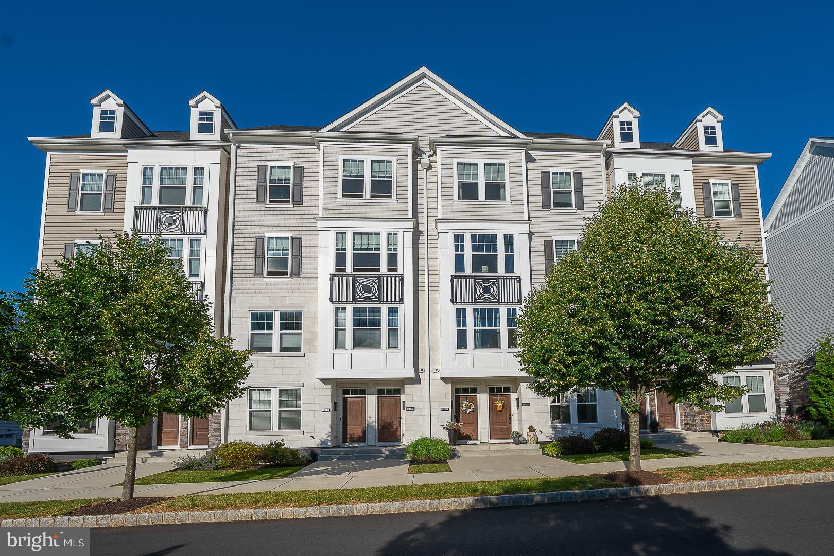 Welcome to 242 Charles Ellis Drive, a beautifully upgraded townhome in the highly sought-after Newtown Walk at Ellis Preserve.
From the moment you enter, it is clear this home is something special. The expansive open-concept main living level offers exceptional space for everyday living and entertaining, combining the kitchen, dining area, living room, and sitting area into one seamless and inviting space. The stunning kitchen serves as the heart of the home with an oversized quartz island, extensive cabinetry, stainless steel appliances, designer lighting, and abundant storage. Just beyond, the living room features a striking custom fireplace wall with built-in shelving and cabinetry, creating a warm and sophisticated focal point. Plantation shutters, recessed lighting, custom finishes, and neutral décor add style and functionality throughout.
Step outside to a private balcony overlooking the rear of the community, perfect for morning coffee or evening relaxation.
The second level features a spacious primary suite with hardwood flooring, a private balcony, a custom-designed oversized walk-in closet, and a luxurious bath with double vanities, soaking tub, and oversized shower. Two additional bedrooms, a full hall bath, and a convenient laundry room complete this level.
One more flight up leads to the spectacular rooftop terrace—an exceptional outdoor living space. Whether entertaining friends, dining al fresco, or simply enjoying the views, this private retreat is sure to become a favorite gathering place. This home is completed by an attached garage at the lower level. 
Located just steps from Whole Foods, restaurants, fitness facilities, walking trails, and the many amenities of Ellis Preserve, this home offers the perfect combination of luxury, convenience, and low-maintenance living in one of Newtown Square's most desirable communities.
Move right in and start enjoying the lifestyle.