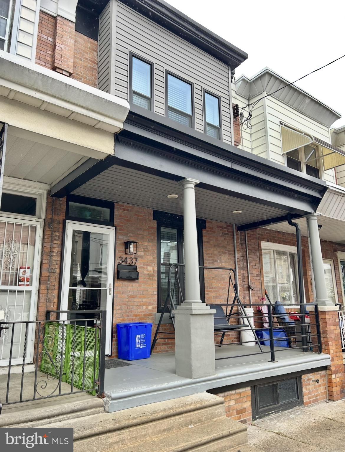 Beautifully upgraded straight-through home —this property is sure to impress. The inviting front porch features a sleek black steel railing and a concrete floor, offering the perfect space to relax and enjoy the fresh air. Step inside through a modern farmhouse-style door into an open-concept living area, highlighted by custom lighting and a striking natural brick accent wall. The space flows seamlessly into the dining area, maintaining consistent lighting and carpeting throughout (with beautiful hardwood flooring underneath). The ultra-modern kitchen is a standout, featuring oversized shaker cabinets, stainless steel appliances with a range hood, custom countertops, and under-cabinet lighting. Just beyond the kitchen, you’ll find a convenient laundry area, a half bath, and access to a fenced rear yard—ideal for outdoor enjoyment. Upstairs, the main bedroom showcases another exposed brick accent wall, generous closet space, and plenty of room for any design style. Two additional bedrooms and a stylish, updated hall bathroom complete the upper level. The lower level offers open space for storage or potential finishing, along with a newer heater, central air system, and hot water heater. Additional updates include newer windows throughout. This well-maintained home is located on a great block with friendly neighbors, ample parking, and is within walking distance to everyday conveniences.