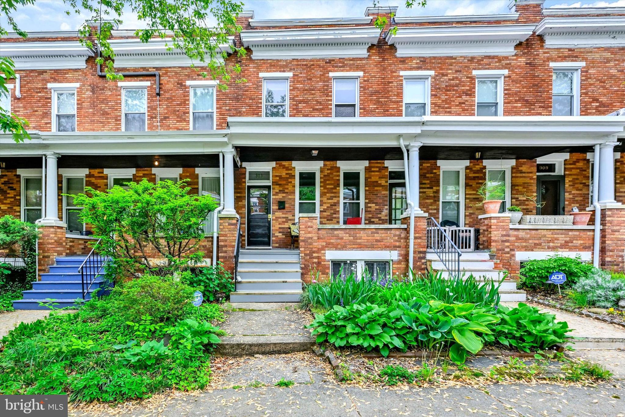 Located in Baltimore City’s desirable Oakenshawe neighborhood, this classic two-story brick home offers timeless charm and an unbeatable location on a quiet one-way street.

A welcoming front porch sets the tone as you enter to beautifully preserved hardwood floors, original trim, and classic character throughout. The main level features a spacious living room, dining room, and an inviting kitchen with a large center island offering seating for family and guests. A vintage sink and charming side pantry complete the space.

Just off the kitchen, step outside to a private patio perfect for entertaining, relaxing, or creating a small garden retreat.

The second floor offers three bright bedrooms with hardwood floors and abundant natural light. The bathroom is full of character with well-preserved original tile, a clawfoot tub, and an interior skylight that fills the center of the home with natural light.

The full basement includes a bonus full bath and a rear walkout. One side has been transformed into a music studio or recreation room where you can close the door and enjoy the peace and quiet, while the other side provides valuable storage space.

All of this just moments from Johns Hopkins University, 32nd Street Farmers Market, and the many shops and restaurants that make this neighborhood so sought after.