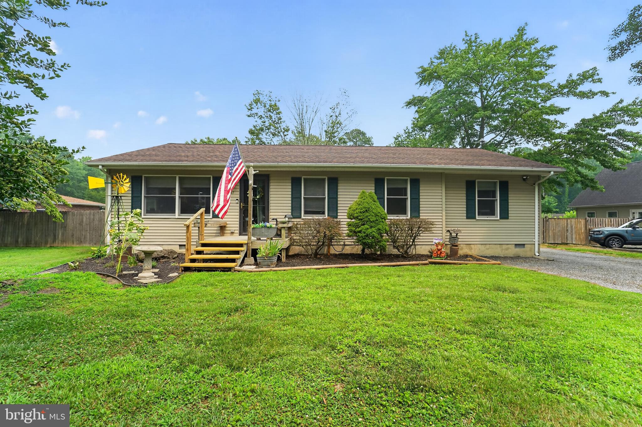 Grasonville - This home offers 3 bedroom and 3 baths located on 1.2 acres.  The garage space is amazing for all of your projects.  Featuring two garages, one car oversized attached is heated and with an oversized two car detached 24x 30 with heat and AC.    The house roof is a 50-year shingle with about 7 years on it.  You will enjoy the fall and the rest of the summer in the large screened in porch.  NO Hoa or restrictions.  This is the home you have been looking for.  Call today for your showing appointment.