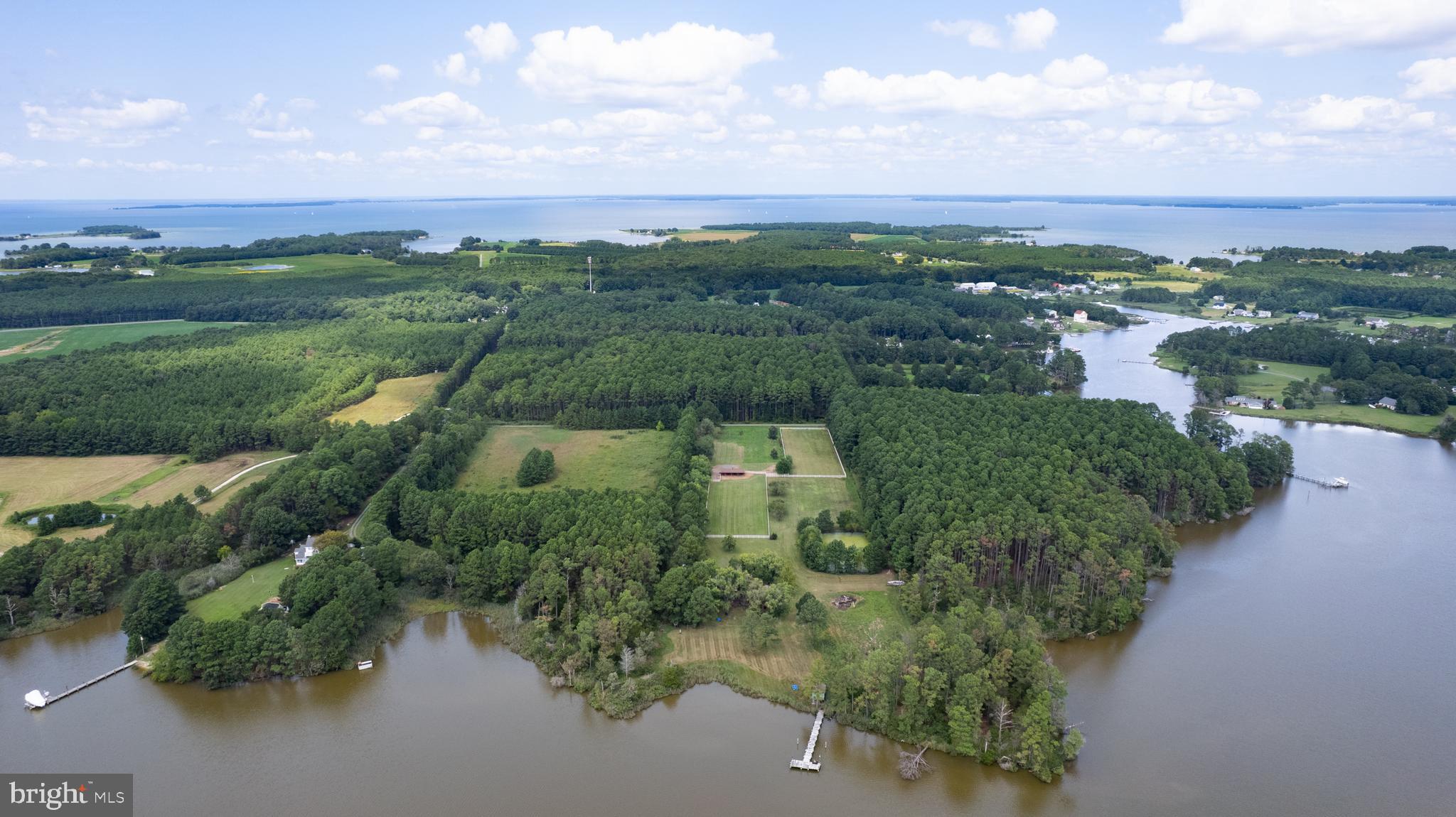 Do you dream of a serene escape that offers space for horses, waterfront views, and unlimited potential? This 10-acre horse farm on Hudson Creek in Dorchester County might just be the solution you’ve been looking for.

The property is already set up with two fenced pasture areas, a barn, run-in shed, storage shed, and fresh water systems designed to care for your horses. It’s a peaceful and private setting, promising quiet moments and unchanging landscapes due to limited future development in the area.

Water lovers will appreciate the 100-foot T-shaped pier offering over 4 feet of mean low water on protected Hudson Creek. From here, access the Chesapeake Bay easily or indulge in the best crabbing and fishing the region has to offer. There’s even a charming old crab shack near the shore, which, with some repairs, can regain its full potential.

The oversized, detached brick 4-car garage is a bonus—ideal as a workshop, storage for hobby equipment, or a safe haven for collectible vehicles. Meanwhile, the main all-brick house, sold AS IS, offers a chance to renovate or rebuild. Featuring a brick fireplace, three bedrooms, two-and-a-half bathrooms, and an attached 2-car garage, this property allows you to create the perfect home tailored to your needs.

If privacy, opportunity, and wide-open spaces are what you’ve been seeking, your search ends here. Welcome to your dream opportunity!