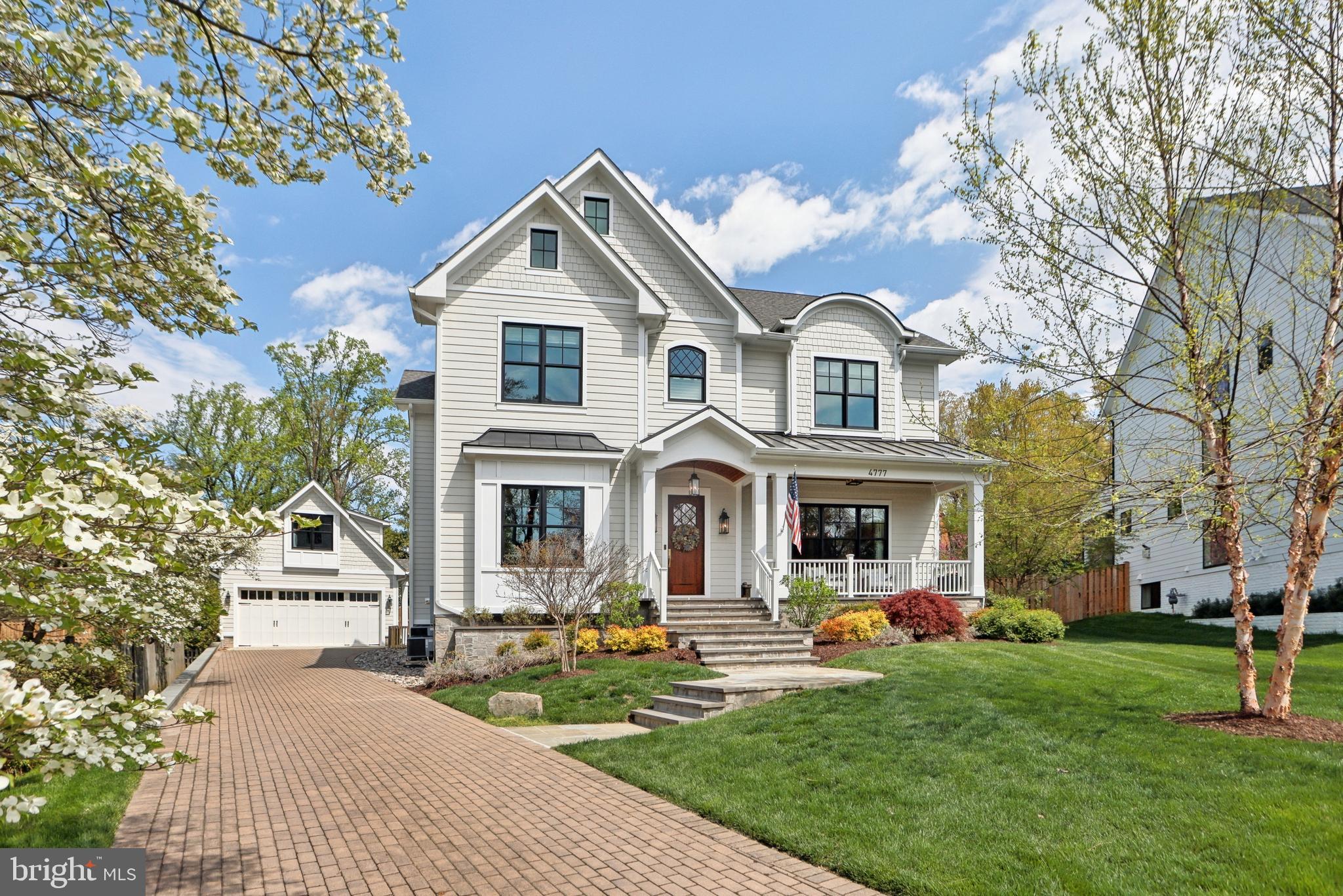 Set on a quiet cul-de-sac in one of North Arlington’s most coveted neighborhoods, this 2020 custom home is a standout in both design and execution.

With 10-foot ceilings on all three levels, this home offers exceptional scale and flow. The main level features a sunlit library with built-ins, a formal dining room with butler’s pantry, and a gourmet kitchen with statement island and walk-in pantry that opens to a spacious family room with coffered ceilings and a striking fireplace as the centerpiece. French doors lead to a flagstone patio, large fenced yard, and a gazebo with fire pit.

Upstairs, the primary suite includes radiant heated floors, a spa-style bath, and a dream come true wraparound walk-through closet. Two additional large and bright en-suite bedrooms and a laundry room with cast iron sink and butcher block counter complete the level.

The lower level adds a new layer of refined living, featuring two bedrooms with full egress windows, a stylish full bath, a dedicated home gym with antimicrobial flooring, and a stone-clad fireplace topped with a walnut mantel.

Details matter here: from the mudroom with custom cubbies, distressed tile, and hardwood bench to custom trim throughout, Emtek crystal knobs, high end lighting fixtures, and 5-panel solid doors throughout.

The oversized detached garage includes a full upper level—unfinished and ready for a studio, office, or flex space offering rare versatility in a high-end setting. Easy to show and a pleasure to visit, check out 4777 33rd St N today!