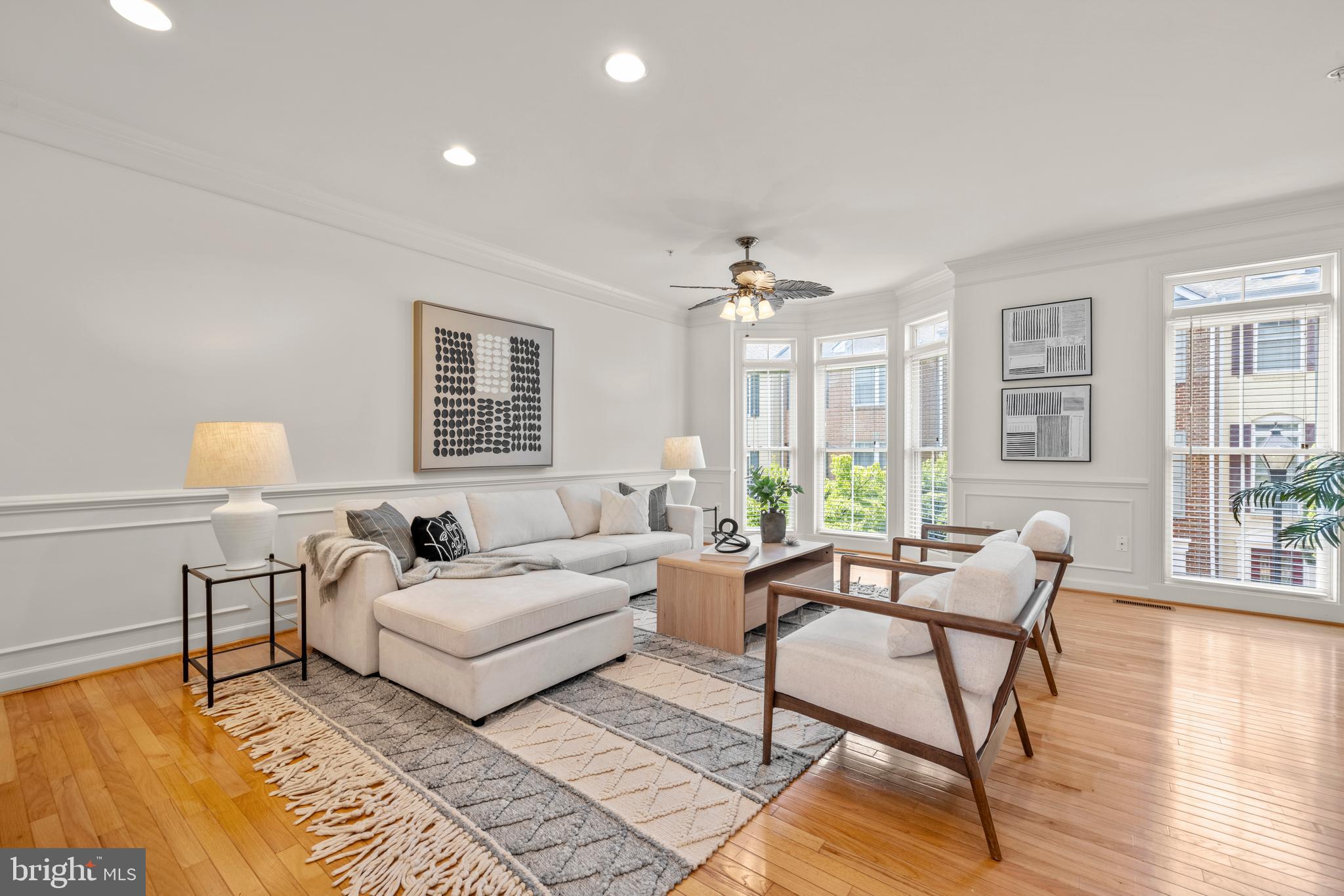 Welcome to 2311 Georgia Village Way, where light, space, and thoughtful updates come together in this beautifully maintained Silver Spring townhouse. The sun-filled open floor plan features gleaming hardwood floors, oversized windows, fresh paint, new carpet, and a spacious kitchen with a double oven, making it perfect for both everyday living and entertaining.

Upstairs, the expansive primary suite offers a walk-in closet, dual vanities, a relaxing soaking tub, and a separate shower. Two additional generously sized bedrooms and a full hall bath complete the upper level. The lower-level den with a cozy gas fireplace provides the ideal space for a home office, recreation room, or comfortable retreat. A two-car garage, upper-level laundry, and abundant storage add to the home's everyday convenience.

This home has been meticulously maintained and thoughtfully updated throughout ownership. Recent improvements include fresh interior paint and new carpet (2026), garage door motor (2026), updated bathroom toilet components (2026), exterior power washing (2026), dishwasher and refrigerator (2025), oven control board (2025), attic furnace and furnace surge protector (2024), water heater (2020), HVAC condensers (2013 & 2018) with regular professional servicing, PVC exterior trim upgrades, balcony improvements, and additional exterior enhancements.

The roof has been professionally inspected, is in good condition, and has an estimated remaining life expectancy of approximately 5 to 7 years.

Ideally located just 0.7 miles from the Red Line Metro, this home offers exceptional convenience for commuters while being close to shopping, dining, parks, and other everyday amenities. Move-in ready and meticulously cared for, this is a wonderful opportunity to own a beautiful home in a highly desirable Silver Spring location."