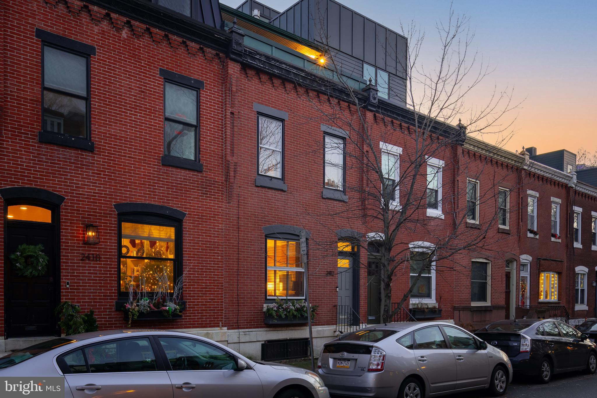 Introducing this Stunning Residence located in Center City, Philadelphia on a tree lined street in the heart of Fitler Square, within the highly rated Albert M. Greenfield School Catchment.  Step into luxury and timeless elegance with this exceptional over 2700 ft.² home featuring an ELEVATOR, providing both convenience and the ability to age in style. This home is just a few blocks from the renowned Rittenhouse Square.  The first floor welcomes you into a classic tiled vestibule while the 1st floor features original wide plank pine flooring and an Italian marble fireplace, all exuding a sense of historic charm and impressive functional space.  French doors lead from the Living Room into the spacious Dining Room. Neatly tucked between the Living Room and Dining Room is a nicely appointed powder room and coat closet. Every detail of this first floor has been carefully thought out. As you move to the kitchen you will find Stainless steel appliances, an abundance of granite countertop space and a bay window that overlooks the charming outdoor garden. The sliders lead you to the  recently renovated patio and newly landscaped gardens, all creating an ideal setting for entertaining and enjoying the outdoors. The beautiful Walnut staircase leads you to the second floor which  offers two large bedrooms (one is currently being used as an Office / Den), a tastefully updated full bathroom and a laundry room providing comfort and convenience at every turn.  Ascend to the third floor using the glass enclosed staircase. Here you will discover a magnificent Main Bedroom Suite, complete with a gas fireplace, a customized walk-in closet and a charming updated full bathroom with glass shower. Other notable features include vaulted ceilings, two skylights, sliders leading out to a spacious terrace offering breathtaking views of the Philadelphia city skyline. Looking for more space? The basement has been partially finished and previously housed a pool table making this space prime for a man cave or or kids play area. Enjoy the proximity to Schuylkill River Park, the quaint Fitler Square (with a year round farmers market) as well as the nearby Café Lutecia and Rival Brothers coffee bar. All this and more adds to the allure of this remarkable residence. With its amazing location and luxurious features, this home presents an unparalleled opportunity to embrace the best of city living in Philadelphia's prestigious Fitler Square neighborhood. Additional improvements include a new AC unit for the upper level (dual zoned) and brand new kitchen refrigerator.