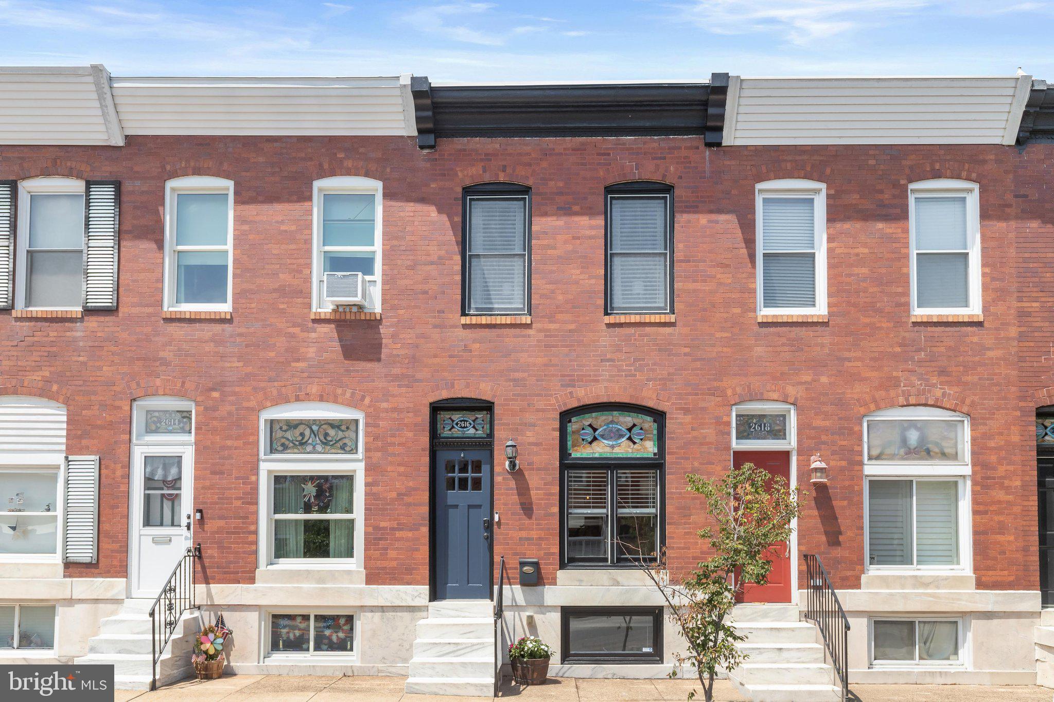 Introducing this exquisite rowhome in the heart of the sought-after Canton neighborhood, offering the perfect blend of timeless charm, modern updates, and an unbeatable location. With two bedrooms, three full bathrooms, and three finished levels of living space, this home also features a private rear deck and a coveted parking pad. Inside, hardwood floors extend throughout the main and upper levels, complemented by a neutral color palette and abundant natural light. The open-concept main level is rich with character, showcasing recessed lighting, crown molding, stained glass transom windows, and an exposed brick accent wall in the inviting living room. A dedicated dining area with a lighted pantry closet provides an ideal space for everyday meals and entertaining, while the updated kitchen is appointed with granite countertops, stainless steel appliances, shaker-style cabinetry, and a breakfast bar. Upstairs, the spacious primary suite offers a private en-suite bathroom and an organized closet system. The second bedroom features a walk-in closet and direct access to the rear deck, while the hall bathroom is illuminated by a bright skylight. Downstairs, the finished lower level expands the living space with a generous recreation room that can easily serve as a guest suite or additional bedroom, accompanied by a third full bathroom with a walk-in shower. A large utility room provides laundry facilities along with a workshop area for hobbies or extra storage. Located in the heart of the vibrant Canton neighborhood, this home is a short walk away from an array of restaurants, pubs, parks, shops, grocery stores, fitness centers and so much more. Stroll along the scenic Waterfront Promenade and Canton Waterfront Park, explore Patterson Park and O’Donnell Square, shop for everything you need at Canton Crossing, or simply enjoy the lively atmosphere of this sought-after community.