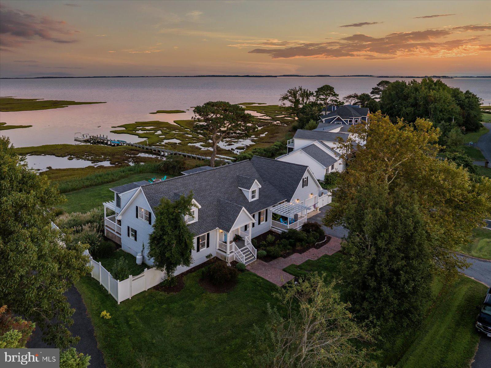 Wake up to stunning open water views of Sinepuxent Bay and Assateague Island from this beautifully updated 4BR/3.5BA Cape Cod, perfectly situated on nearly ¾ of an acre in the peaceful Genezer Estates community. Inside, you’ll find a bright and spacious layout featuring two bedrooms on the main level and two upstairs—ideal for multigenerational living, guests, or flexible home office space. Tons of windows, flood the home with natural light while framing the incredible views. With over 3,000 sq ft of finished space, a two-car garage, and a large, cleared yard, this home offers comfort, versatility, and unforgettable sunsets—all just minutes from Ocean City beaches, marinas, and golf.