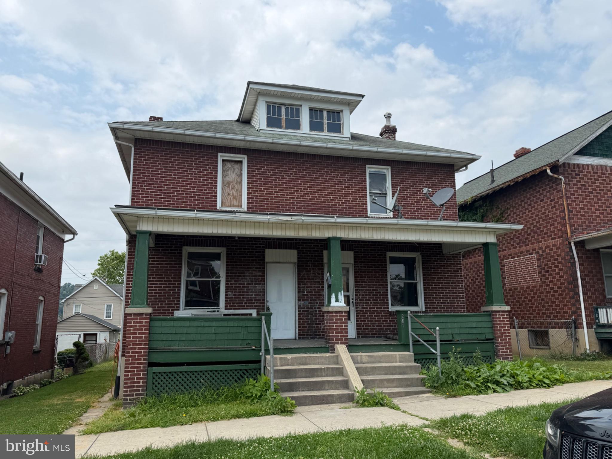 Investor Special! Opportunity awaits at 211 Pennsylvania Avenue in Cumberland. This all-brick duplex offers two spacious units, each featuring 3 bedrooms. Left side 211 has 1 full bath, and right side 213 has 2 full bathrooms! Making it an attractive option for investors looking to renovate and add value.
Packed with character, the property showcases original woodwork, hardwood floors, large rooms, and a classic covered front porch. A walk-up attic, full basement, fenced rear yard, and detached storage building provide additional potential and storage space.
Whether you’re looking to expand your rental portfolio, pursue a fix-and-flip project, or create long-term cash flow, this property offers solid bones and plenty of upside. Conveniently located near downtown Cumberland, shopping, dining, and major commuter routes.
Bring your vision and restore this duplex to its full potential. 

**This property is eligible for City of Cumberland Rehabilitation Grant, ask for more info!**