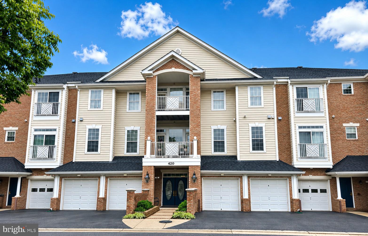 Welcome to this beautiful top-floor penthouse condominium in the sought-after 55+ community of The Hamlets at South River Colony! This spacious home features 9-foot ceilings, abundant natural light, and an open floor plan designed for comfortable living and entertaining.  The upgraded kitchen offers maple cabinetry, black stainless steel and stainless appliances, gas range, tile backsplash, double sink with dual garbage disposals, and a custom-built breakfast nook with additional pantry cabinetry for exceptional storage.  The inviting living room features a cozy gas fireplace with French doors on both sides leading to the private balcony, accented by elegant transom windows that fill the space with natural light.  The spacious primary suite includes a ceiling fan, two closets—including a walk-in closet—both with custom closet organizers. The en-suite bath offers dual cultured marble vanities, a large walk-in shower, and an oversized linen closet. The second bedroom also features a ceiling fan and is perfect for guests or a home office.  Additional highlights include a full-size laundry room with extra storage cabinets.  A ground floor attached garage with automatic door opener and remote, which enters into the interior of  the building for extra security.  This building elevator adds convenience.  Residents enjoy outstanding community amenities including two swimming pools, tennis and pickleball courts, walking trails, a community center, tot lot, and access to the South River Golf Course, where memberships are available. The Anne Arundel County Library, Senior Activity Center, restaurants, shopping, and everyday conveniences are all just next door.