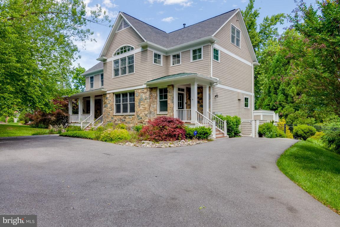 Gorgeous and ready to move in to this 5 bedroom and 4 plus bathroom home with multiple decks and a stone patio off the back of the house. Has hardwoods throughout the main level as well as the stairs. There are 4 finished levels with a 2 car garage and large backyard.