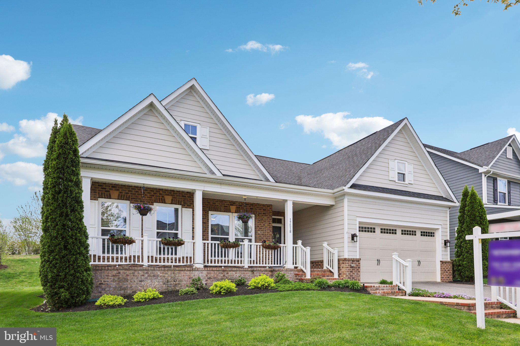 Gorgeous MAIN LEVEL living in desirable Potomac Shores! With over 3400 square feet, this 2016 Ryan home built on a premium lot is the epitome of comfort and elegance. From the moment you walk in, you'll appreciate the hardwood floors, open floor plan with plenty of space for entertaining, and the gourmet kitchen. With an island, granite countertops, and upgraded cabinetry, there's also a view of the deck and green space (no neighbors behind you!). The main level features two bedrooms. The main level primary suite is spacious enough to fit your furniture  and has a spa-like bath with stand up shower and dual vanities. A study on the main level could easily be  an additional bedroom if a closet was added. Downstairs, there are two bedrooms (one currently used as a fitness room), custom wood-panel accent walls, and a large living space. Other notable upgrades include a low-maintenance trex deck and pergola, sprinkler system, French drains, lower level bedroom/fitness area, and a wet bar. Potomac Shores offers resort-style amenities like a Jack Nicklaus Signature Golf Course, The Shores Club fitness and recreation center, miles of nature trails, pools, and courts for basketball, tennis, and pickleball. High-speed internet, neighborhood events, and access to top-rated on-site schools are also included. A new VRE station is coming too. Don't miss this home- schedule a showing today!