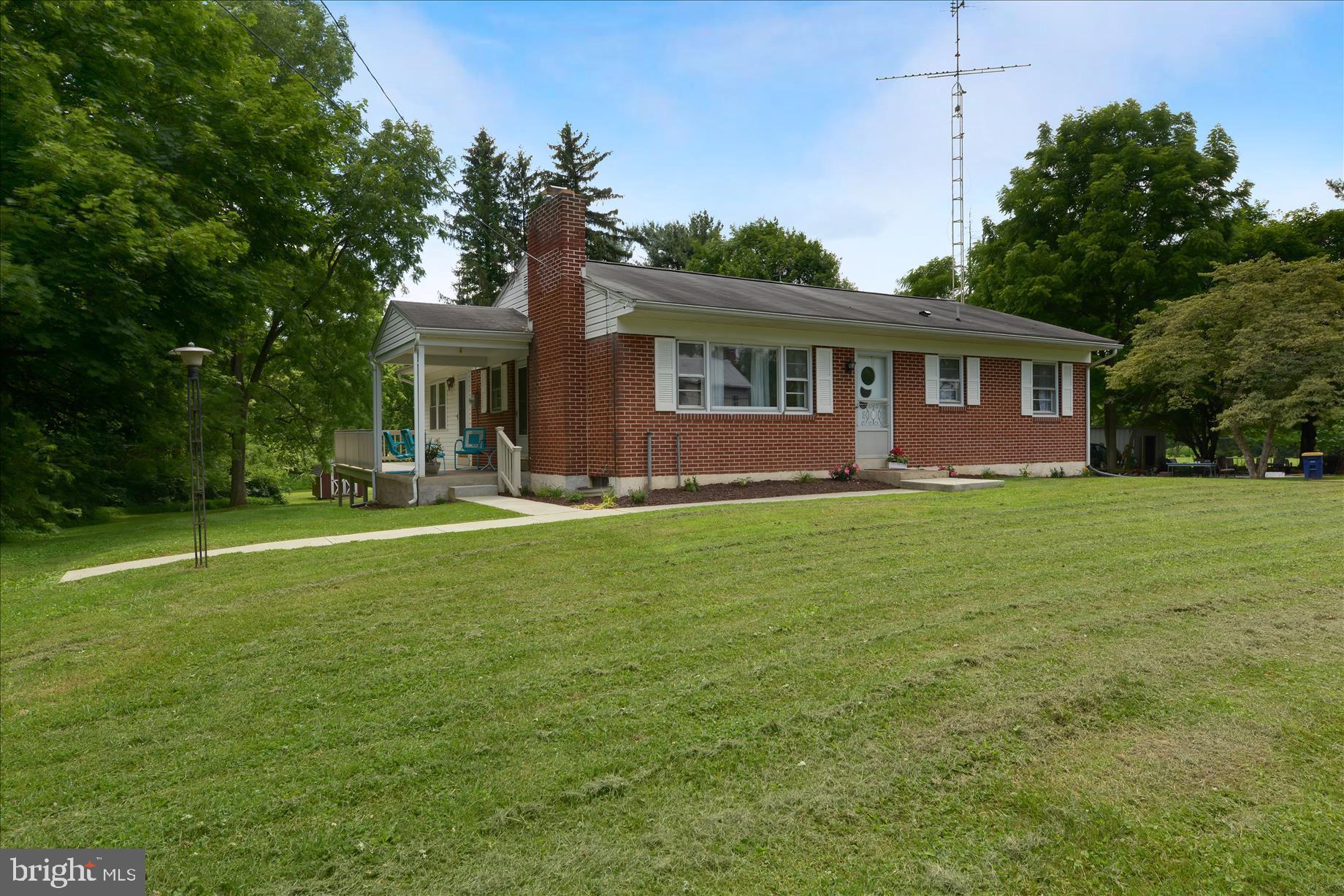 Private backyard!  ....2 plus acre homestead with Ranch home!  Bring your chickens!  Ranch home consists of 3 bedrooms, 1 bath, living room, dining room and galley kitchen.  Hardwood floors on the main floor!  Deck on the side and extra large patio for outdoor entertaining!  Walk-out basement with patio doors.  Bring your creativity and sense of home ownership!