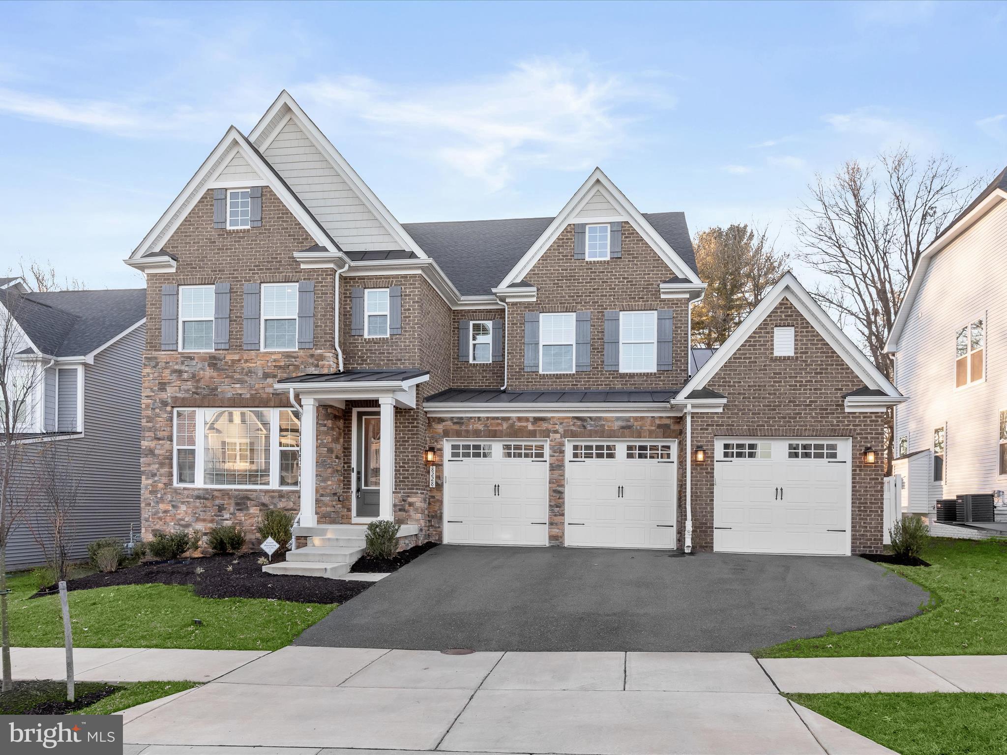 Welcome home to 8228 Gunnar Drive in coveted Maple Lawn South! This exquisite luxury property is a premiere offering in this highly sought-after community. Built in 2021, this fully loaded Tyler Model boasts 5 bedrooms, 5.5 bathrooms and 5,648 total square feet of every upgrade imaginable. There are number of features that truly set this home apart: the rarely available main-level bedroom suite, 3-car garage, screened-in patio and fully fenced back yard. Both the main and upper levels feature wide-plank luxury vinyl plank flooring. The main level bedroom suite is thoughtfully finished with a large picture window, walk-in closet and its own full bathroom with shower. The private office, also on the main level, offers French doors, recessed lighting and two windows providing an abundance of natural light. 

The open concept living and dining areas center around an inviting gas fireplace and make for the perfect places to entertain. The kitchen boasts every accoutrement desired by a gourmet chef and looks as magazine-worthy as it is functional. You’ll find shaker-style cabinetry with a contrasting island, a double oven, smart fridge, quartz countertops, under-cabinet lighting and an on-trend stainless steel farm sink. The spacious walk-in pantry and welcome center are conveniently located just off the entry from the 3-car garage providing the perfect family drop zone. The screened-in patio is a quiet retreat all its own and is found just off the eat-in kitchen area.  

Upstairs, four more spacious bedrooms await connected by an expansive loft area at the upper level landing. The primary bedroom features trey ceilings, recessed lighting and two large walk-in closets. The primary bath can only be described as a spa-like retreat with its multi-head shower, jetted tub and separate quartz vanities. The secondary bedrooms feature either an en suite bath or buddy bath and the laundry room completes this level, conveniently located upstairs. 

The luxe lower level of this home includes a spacious recreation room complete with recessed lights, a stone accent wall, and a built-in bar with all the bells and whistles: quartz countertops, a beverage fridge and a dishwasher. There is an additional full bathroom downstairs as well as an unfinished utility area for bonus storage space. With a fantastic community pool and gym and conveniently located close to major commuter routes and so many fantastic shops and restaurants, come see why the Maple Lawn communities are the premiere communities in Howard County. Hurry! 8228 Gunnar Drive won’t last long.