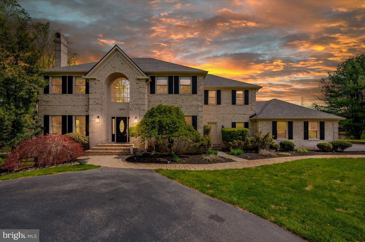 Luxury, privacy, and timeless elegance converge at this remarkable estate in the coveted Twelve Hills community of Clarksville — a prestigious neighborhood with no HOA and an unparalleled reputation for upscale living. Nestled on a breathtaking 3.4-acre lot that backs to protected forest conservation, this exceptional property offers both tranquility and convenience, creating the perfect balance between nature and refined living. As you arrive, a long, circular driveway guides you through mature landscaping to a grand entrance that commands attention and sets the stage for the home’s impressive scale. The stately façade is complemented by an oversized three-car garage. Step through the front door into a soaring two-story foyer, where natural light pours in and highlights the home’s thoughtfully curated updates and timeless charm. Spanning over 5,000 square feet, the residence features a versatile floor plan that blends open-concept spaces with modern-traditional design—ideal for both everyday living and elevated entertaining. The main level showcases fresh paint and new re-finished flooring throughout, creating a clean, cohesive aesthetic. A spacious formal living room and elegant dining area offer the perfect setting for holiday gatherings or intimate dinners, while two wood-burning fireplaces throughout the home add warmth and character. The expansive gourmet kitchen flows seamlessly into the incredible morning room, which boasts panoramic views of the surrounding woods and pool—making it the perfect place to start your day. Just off the main living areas, step onto the oversized deck, where you’re greeted with views of your private outdoor oasis. Whether you’re relaxing poolside or hosting a summer soirée, the newly retiled and re-coped in-ground pool has been completely updated with brand-new equipment and is accompanied by a brand-new pavilion. Upstairs, the home features four generously sized bedrooms, including an impressive primary suite with a luxurious ensuite bath. The primary bathroom offers both size and function, with dual vanities, a soaking tub, and walk-in shower—truly a retreat within your home. Each bedroom provides ample space, storage, and serene views of the surrounding greenery. The finished lower level is designed for comfort and flexibility, offering additional entertaining space, recreation zones, or the opportunity to create a home theater, fitness area, or guest quarters with the fifth bedroom, tailored to your lifestyle. With a new roof, 2021 water heater, and new washer and dryer, the major systems of the home have been thoughtfully updated. Beyond the home itself, the setting is truly what makes this property a rare offering. Backing to acres of untouched forest conservation, you'll enjoy unmatched privacy and serenity, all while being just minutes from the area's best schools, shopping, commuter routes, and more. Whether you're seeking a private estate, a home designed for entertaining, or a peaceful sanctuary with modern conveniences—this residence in Twelve Hills delivers it all. No HOA. Just timeless luxury, natural beauty, and an incredible opportunity to live in one of Howard County’s most desirable communities. *Sellers prefer Friends Title and Escrow*