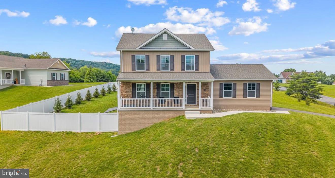 Discover ultimate peace and tranquility in this beautifully maintained, move-in-ready premium home, less than three years old. Nestled in a peaceful wooded setting with breathtaking mountain views, this home offers the perfect sanctuary from the hustle and bustle of Washington, DC, and Baltimore, just a short drive away.
The Living Space: Designed for exceptional indoor and outdoor living, the main level features an inviting layout with a cozy fireplace and a modern custom kitchen. The fully finished walkout basement adds an entire level of luxury living, featuring a large recreation area, an extra bedroom, a full bath, and abundant custom storage. 
Outdoor Oasis: Step outside onto the expansive upper deck or the lower-level patio, complete with a retractable awning and outdoor furnishings—perfect for relaxing, entertaining, or listening to the birds. The backyard features a premium privacy fence, making it an absolute paradise and a secure haven for your large pets. 
The Location: Immerse yourself in nature. You are just minutes away from the pristine trails of Cacapon State Park and the historic, healing mineral springs of downtown Berkeley Springs. The home also features Frontier Fiber high-speed internet with affordable service, making it ideal for remote work, streaming, and gaming.
Peace of Mind: As a home that is less than three years old, it includes transferable warranties on the roof and foundation, providing added confidence and peace of mind for the new owner. This is a true turnkey opportunity to own a piece of mountain paradise. Offered directly by the owner for a smooth, transparent transaction.