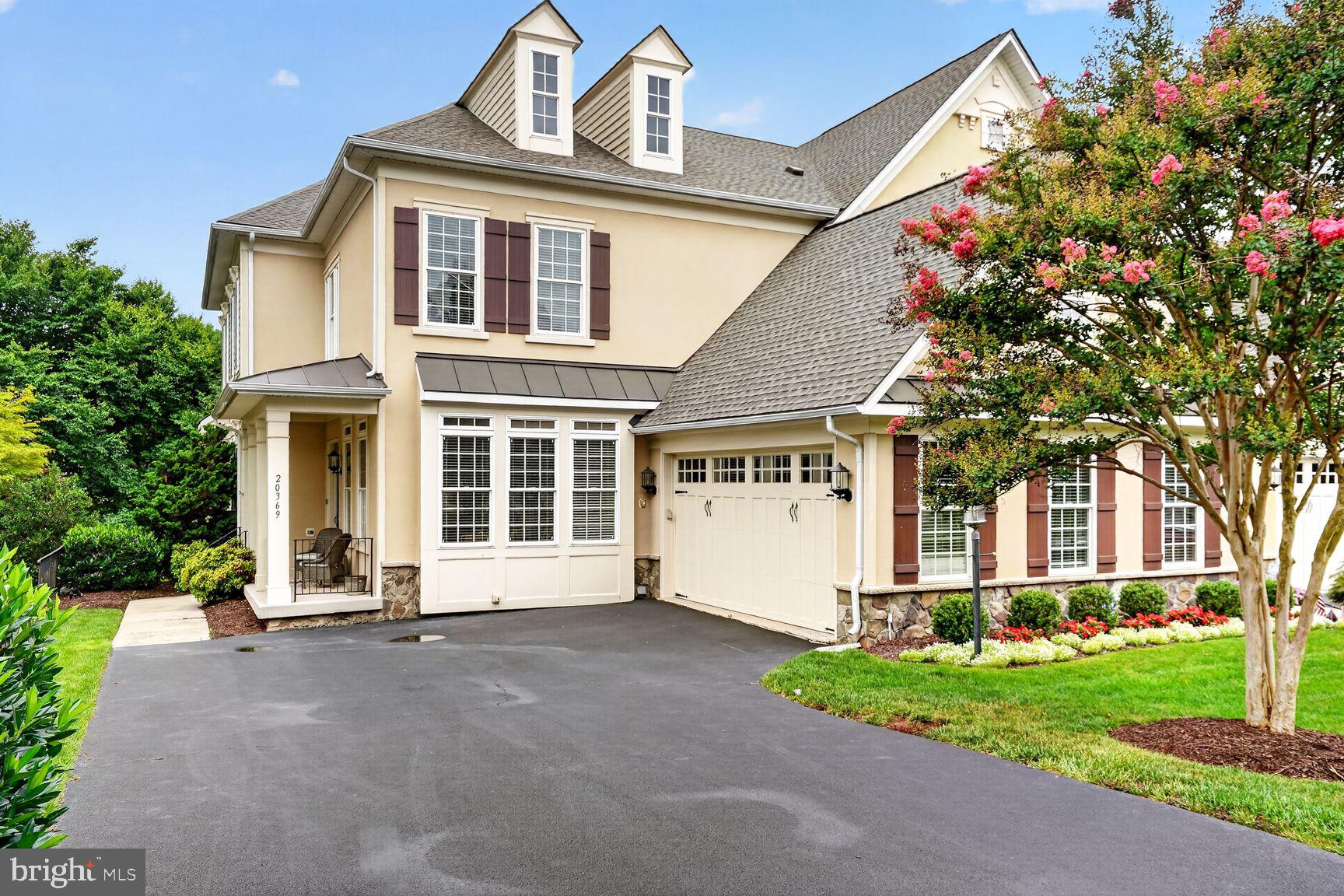 Nestled in the highly desirable Cascades/Lowes Island community, this spacious end-unit townhome offers over 4,300 square feet of well-designed living space with an open, light-filled floor plan that's ideal for both everyday living and entertaining.

The main level features hardwood floors, ceramic tile, crown molding, chair rail, recessed lighting, and a large family room with a fireplace. The kitchen includes upgraded countertops, a center island, built-in appliances, ample cabinet space, and opens directly to the family room.

Upstairs, the primary suite offers a walk-in closet and an en-suite bath with a soaking tub, separate shower, and dual vanities. The additional bedrooms are generously sized, providing flexible space for family, guests, or a home office.

The finished lower level offers additional living space that can be used as a recreation room, media room, home gym, or playroom.

Enjoy outdoor living on the private deck and patio, surrounded by mature landscaping. The attached two-car garage provides plenty of parking and additional storage.

Residents of Cascades/Lowes Island enjoy outstanding community amenities, including multiple swimming pools, tennis and pickleball courts, fitness centers, walking and biking trails, playgrounds, and community centers. Conveniently located near shopping, restaurants, golf courses, and major commuter routes including Route 7, Route 28, and Fairfax County Parkway, this home offers an exceptional combination of space, location, and lifestyle.
