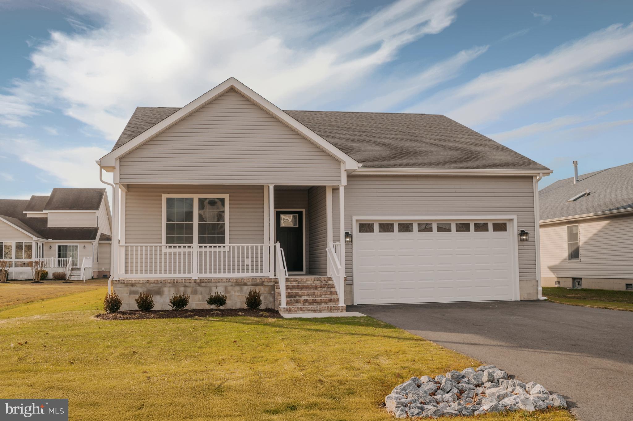 JUST 3 MILES FROM FENWICK ISLAND - Construction is underway - MAY Completion.  This stunning new home features three bedrooms and two full bathrooms. The open floor plan offers a spacious kitchen with a large island, quartz countertops, stainless steel appliances, and luxury vinyl plank flooring in the main living areas. The bedrooms are carpeted for added comfort. Enjoy the convenience of a large two-car garage and the charm of a lovely front porch, complemented by a SCREENED PORCH at the rear of the house. 

LOW TAXES:  The property is located in Sussex County, and there are no additional municipal or city taxes.

AMAZING HOA - The low HOA fee includes a community swimming pool!  The well-maintained, established community is located on  Rt54, just 3.5 miles from the beach in Fenwick Island and North Ocean City, MD!  Weekly rentals are allowed.
 

Quality construction:

Exterior Walls: Stick-built with 2"x 6" exterior walls set at 16" on center, ensuring exceptional strength and durability.

Foundation: Constructed on a 5-course block foundation with a conditioned crawlspace for enhanced comfort and energy efficiency.

Porches: Features a front porch adorned with decorative rowlock brick for added elegance.  A screen porch is located on the back of the house.  

Driveway: Includes a blacktop driveway, providing a smooth and durable surface.

Lot and Location Details:  A small portion of the lot is located within a floodplain, but rest assured, the home is not in the floodplain. Please refer to the attached survey for detailed information.

This property combines quality craftsmanship with modern amenities, making it the perfect choice for your new home.  Photos are another property constructed by the builder but represent similar finishes.