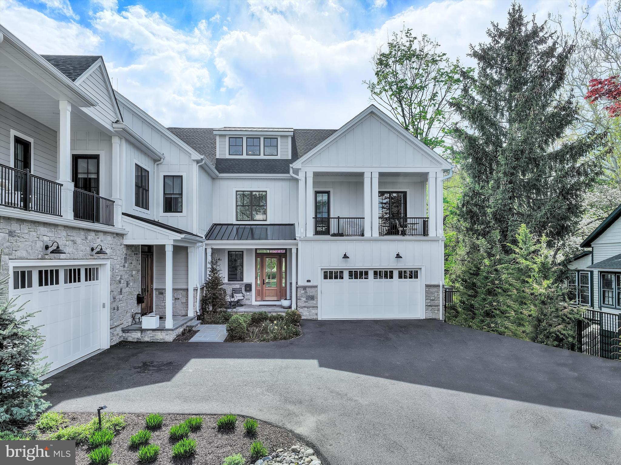 Set along one of the most picturesque and quietly coveted stretches of Main Street in New Hope, this exceptional Riverwalk residence is a masterclass in refined living, where thoughtful design, elevated finishes, and an unrivaled setting come together seamlessly. Built just four years ago by Barley Custom Homes, this home reflects a level of craftsmanship and architectural integrity rarely found.
A welcoming front porch introduces the home with understated elegance, offering a moment of calm before stepping inside. Perfectly positioned along the towpath and just moments from the heart of town, the location offers a rare duality, peaceful, almost tucked-away living with immediate access to the town’s vibrant energy. With the Delaware River just across the street and the towpath steps from your door, the rhythm of daily life is effortlessly connected to nature, morning light over the water, evening walks beneath the trees, all just moments from renowned dining, boutique shopping, and cultural experiences.
Inside, nearly 3,600 square feet unfold with intention and grace. A dramatic open foyer, framed by soaring 10-foot ceilings, sets the tone for the home’s light-filled and expansive design. The main level is both sophisticated and highly livable, anchored by a stunning great room with fireplace that flows seamlessly into the chef’s kitchen, creating a true open-concept environment designed for both intimate moments and elevated entertaining. The kitchen is appointed with Wolf  Sub-Zero appliances and enhanced by a generous walk-in pantry, blending beauty with effortless functionality. A private office or library offers a quiet retreat, while a thoughtfully designed mudroom, complete with abundant storage, connects to the attached two-car garage with ease.
The second level is a study in comfort and customization. The primary suite offers a refined retreat, complete with a spa-inspired bath and soaking tub. One bedroom has been transformed into a boutique-style dressing room with floor-to-ceiling custom cabinetry, an extraordinary and highly personalized space. Two additional bedrooms are complemented by a beautifully appointed shared full bath , offering privacy and refinement for family or guests. One of these rooms, designed with a built-in Murphy bed, opens directly to a private balcony, seamlessly blending indoor and outdoor living. A well-positioned laundry room and an airy loft space further enhance the level’s thoughtful design.
An elevator provides effortless access to all floors, leading to a third-level retreat designed with flexibility in mind, ideal for a lounge, playroom, or additional living space, all complemented by extensive storage and a full bath.
Outdoor living is equally considered.  Glass doors leading out to the  deck,  just off the kitchen invites al fresco dining and quiet mornings, while direct access to the towpath encourages a lifestyle rooted in movement, nature, and ease.
This is more than a home, it is a curated lifestyle offering rarely available along Main Street in New Hope, where luxury, location, and design converge in a way that must be experienced to be fully appreciated.