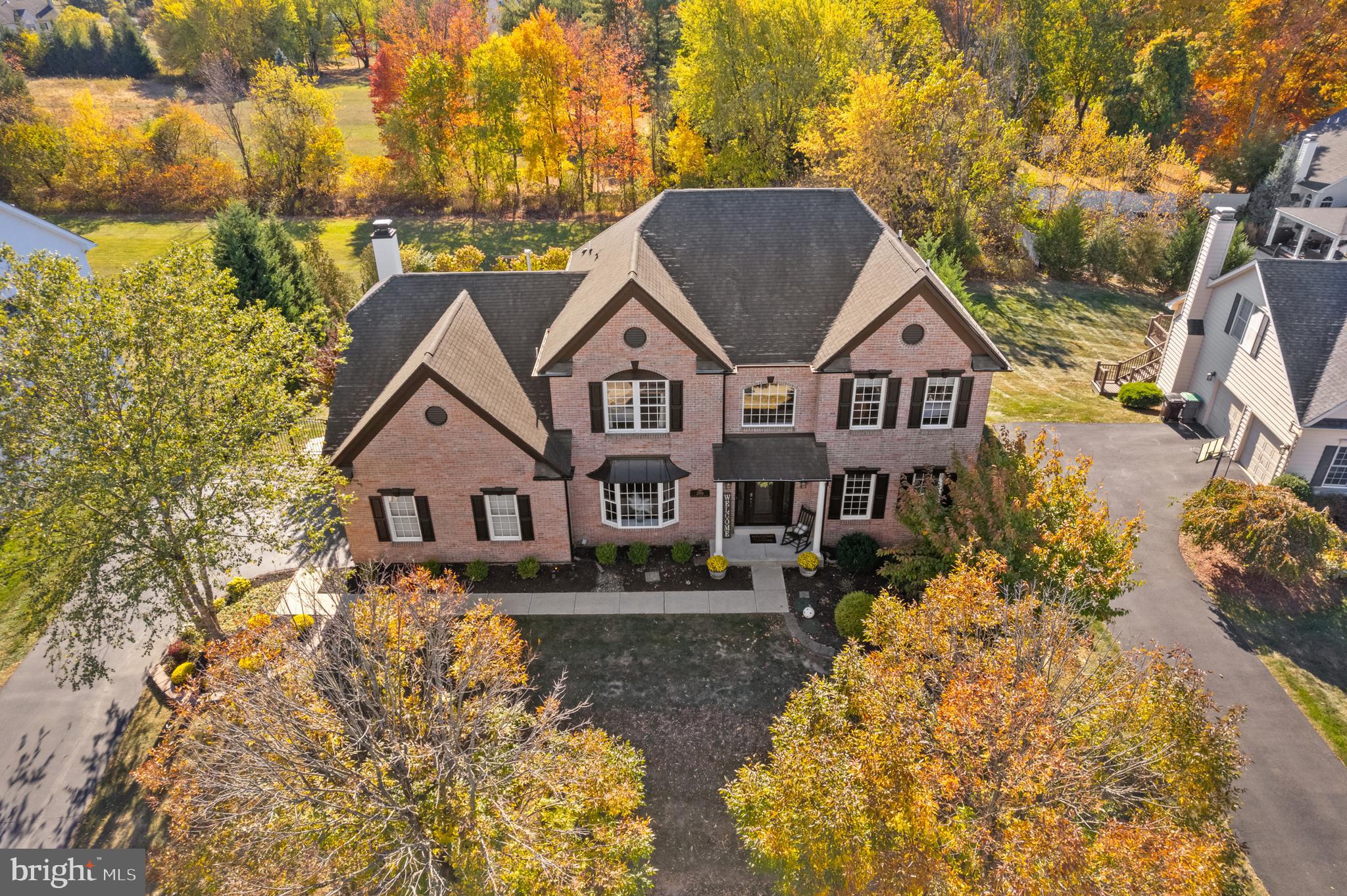 Come see this absolutely stunning 4 bedroom, 3.5 bathroom Chadbourne Provincial located in the sought after development of the Estates of Warrington Ridge.  Offering a perfect blend of outdoor beauty and indoor luxury, ideal for both relaxation and entertainment. As you enter, you'll be welcomed by gleaming hardwood floors throughout creating a warm and inviting atmosphere.  Upgraded trim work in entry, living and dining room.  French doors open to a professional office.  Beautifully remodeled farmhouse style hall powder room. The Gourmet kitchen is a chef’s dream featuring top-of-the-line stainless steel Wolf range and oven, high-powered Zephyr ventilation exhaust hood and under the counter built-in microwave.  Deep, extra-wide undermount sink with gooseneck faucet.  Gorgeous high quality Dolce Vita Quartzite countertops!  Huge kitchen island and coffee bar. Exquisite cabinetry with upgraded features and hardware. Breakfast room with Pella sliding door leads to a TimberTech composite deck with maintenance-free vinyl railing. Step down the deck staircase to an expanded stamped concrete patio with elegant steps and pathway to the driveway. All surrounded by extensive hardscaping. Relax and entertain under the aluminum gazebo, perfect for outdoor dining or lounging. Unwind in the hot tub, adding a spa-like experience to your backyard retreat. With so many areas to entertain, just unpack and enjoy!  Black Aluminum fencing around perimeter of yard offers both style and security. Professionally landscaped grounds along with a beautifully crafted wall.  Inside enjoy the family room with dramatic cathedral ceiling, skylights and fireplace with gas insert (original woodburning). Full size laundry room with laundry tub equipped with washer, dryer and cabinetry above. Inside access through laundry room to an oversized 2-car garage (20 x 20'11") Electric garage door openers each side.   Stunning hardwood staircase with wrought-iron spindles adds a touch of elegance. French doors open to the primary suite with a spacious walk-in closet and luxurious bathroom featuring vaulted ceiling, skylights, dual sinks, a platform tub and a separate glass-enclosed shower. Massive bonus room off of primary suite can be used as an additional walk-in closet, nursery or keep as its current use, a 2nd office.  Each of the additional bedrooms is generously sized with ample closet space, ensuring comfort for family and guests alike. Remodeled hall bathroom features dual sinks.  Lower level features an amazing industrial style finished walk-out basement with battery backup sump pump for added peace of mind. Impressive raised ceiling (extra 1 ½ feet) along with an open-concept painted ceiling. Luxury vinyl plank flooring for durability and style. Sliding barn doors  separate the gym from the game room. Separate unfinished room used for additional storage. Beautiful custom 2-tier granite top wet bar with pendant lighting, gooseneck faucet and undermount sink. Soft close cabinetry and full size built-in refrigerator. Decorative Italian tile on front and side of bar along with many more additional features!  Beautiful full bathroom features low level tub/shower combination for comfort and convenience along with gooseneck faucet and custom lighting. The attention to detail throughout the property is evident, as the home has been meticulously upgraded with quality being the top priority!  With Smart Home features like the Nest thermostat and Ring security system to its elegant design, premium finishes, and exceptional outdoor spaces, this home truly encapsulates luxury living. Don’t miss your chance to make this stunning property your own!