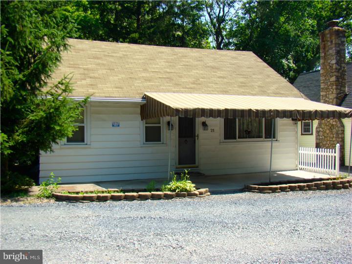 Amazingly priced and well maintained 3BR/1BA ranch home in Blue Mountain. This rancher offers almost 1,300 sq.ft. of easy one floor living. Large living room with picture window; bedrooms offer large/multiple closets; oak cabinet kitchen and dining area; full modern bath; and large floored attic for extra storage. Extra bonus is the spacious rear screened porch with cabinets and bar sink; perfect for entertaining or just relaxing and enjoying your private wooded view. Newer windows, high-end furnace, freshly painted, and plenty of off-street parking make this a must see.