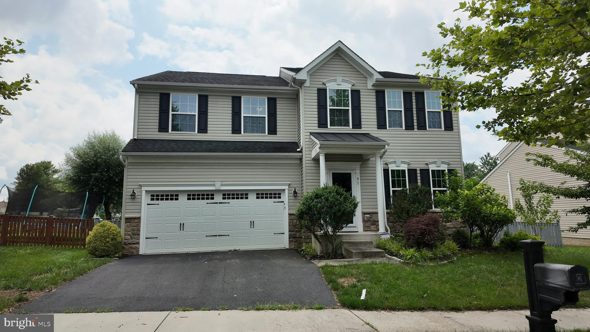 Welcome to this exceptional 5-bedroom, 3.5-bath home that perfectly blends modern comfort, everyday convenience, and peaceful privacy in the heart of Lovettsville. Ideally situated just minutes from the town center, you'll enjoy easy access to grocery stores, restaurants, shopping, fitness facilities, the Community Center, Town Green events, and more. Designed for both comfortable living and effortless entertaining, the main level features a thoughtfully designed open floor plan with custom details throughout. The gourmet kitchen boasts newer appliances, an oversized center island, and abundant cabinetry, flowing seamlessly into the bright breakfast area and inviting family room. A dedicated main-level office provides the perfect work-from-home space or private study. Upstairs, retreat to the spacious primary suite featuring a luxurious en-suite bath, complemented by four additional generously sized bedrooms and a full hall bath. The fully finished walk-up lower level offers exceptional versatility with a large recreation room, family room, full bath, and dedicated exercise area, ideal for entertaining, hobbies, or extended guest accommodations. Enjoy outdoor living in the fully fenced backyard, where the expansive deck provides the perfect setting for grilling, relaxing, or hosting family and friends. Conveniently located just 7 minutes from the MARC Train for commuting while offering the charm of small-town living, this beautiful home truly has it all. Don't miss the opportunity to make this Lovettsville gem your next home!
