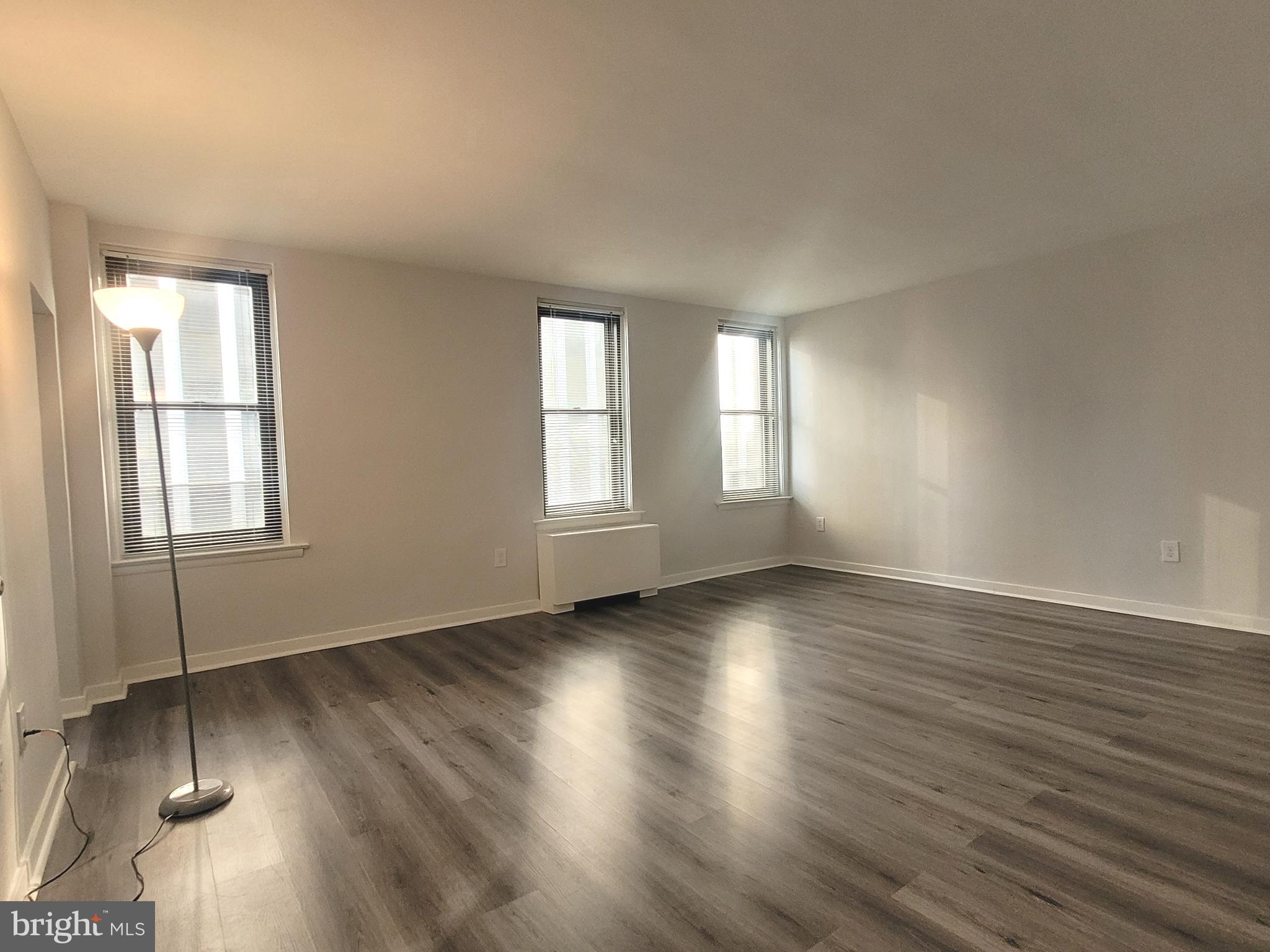 Lovingly cared for studio apartment at The Wellington, located on Rittenhouse Square! The sun-lit living/dining area is beaming with natural light due to three large windows and features two large wall closets with ample storage space. Adjacent, there is a bright kitchen featuring wood cabinetry, white appliances, and white tile floor. The full hall bathroom features tile flooring, shower/tub combination, white vanity, and a linen closet. Washer/dryer in unit.

Pre-war apartment building located on Rittenhouse Square offering a 24 hour doorman and on-site management. Electric, gas, and water are all based on square footage. Tenants pay cable and internet.