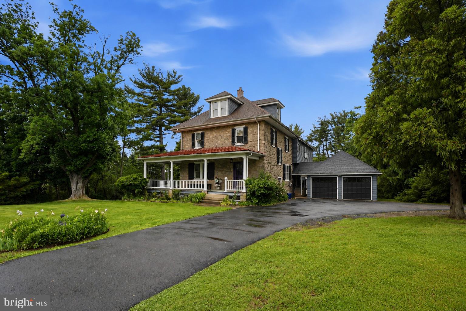 Some homes are built. This one was grown.
Standing since 1900, this six-bedroom stone farmhouse on a private one-acre lot in Dresher isn't just a place to live — it's a place to belong. The kind of home that earns a name. The kind that holds stories in its walls and still has room for yours.
Step onto the wraparound front porch and feel the pace of your life change immediately. Original stone exterior. Generous windows that pull the outside in and flood every room with light. Hardwood floors throughout— some original to the house — that carry more character in a single board than most homes hold in their entirety.
Inside, over a century of craftsmanship meets a thoughtfully modernized kitchen, because this home has evolved while staying true to where it came from. Six bedrooms on the upper level with three full baths and a dedicated laundry room keep daily life organized and effortless.
Step outside from the main level onto the expansive composite deck and you'll understand why whoever lives here rarely wants to leave. The in ground pool glimmers among the gardens, gardens curated over time by owners with an artists eye for color, texture and symmetry.  One full acre unfolds in every direction. A second private deck off the primary bedroom turns morning coffee into something entirely different.
The finished lower level — complete with a kitchenette — is whatever you need it to be: in-law suite, game room, creative studio, or all three at once. A two-car garage connects via a classic breezeway, keeping function as refined as the form.
This isn't a home you simply see—it's a home you feel. Rich in history, filled with warmth, and thoughtfully updated for modern living, this early-1900s gem is best experienced in person.

Features of this home include: *Coveted Upper Dublin School District*Over 4500 square feet of living space*6 Bedrooms* 4.5 Bathrooms*Second Floor Laundry*In Ground Pool*Wrap-Around Porch*2 Car garage*In Law Suite with Separate Entrance and a Full Bath*Private One Acre Lot*Lovely Gardens*Large Shed *Workshop Area
*Square feet are estimates and should be confirmed by buyers