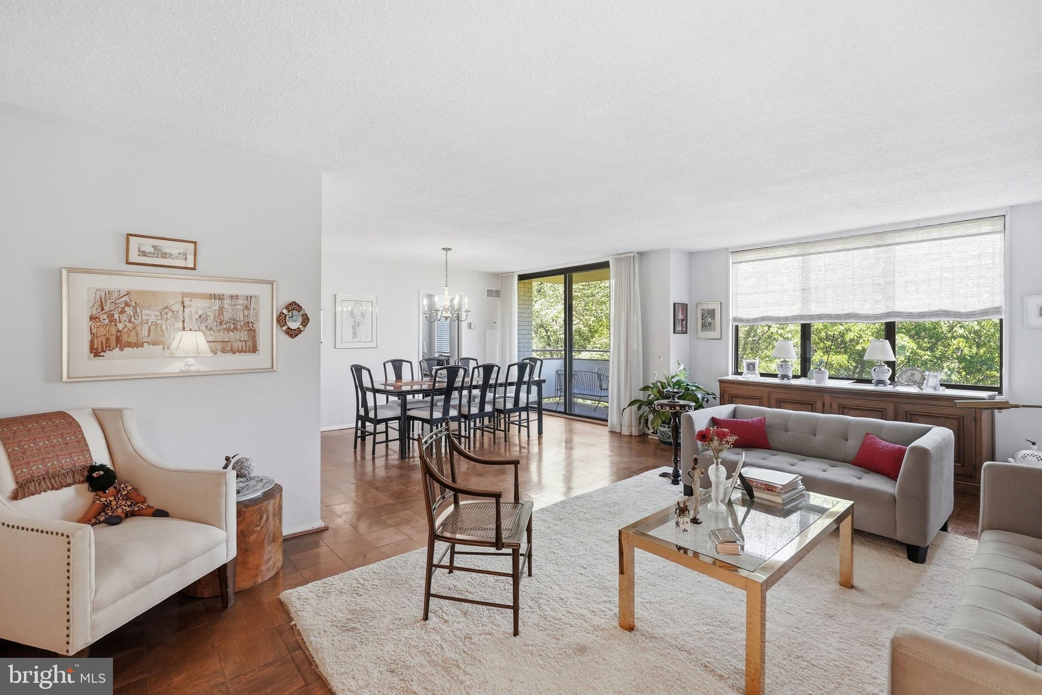 Welcome to this spacious 2 bedroom apartment with high end appliances including an in-home washer/dryer.  
The kitchen has room for a breakfast table.  It has luxury vinyl flooring and a pantry.  Lots of cabinets and a large granite counter.  The cook’s kitchen has a Whirlpool microwave and dishwasher, and Frigidaire stove and refrigerator (with ice maker).  There are oversized windows throughout the apartment with an amazing view of a gorgeous grove of trees just outside the window.   The second bedroom is on the opposite side of the apartment from the primary bedroom.  Off the dining room is  a balcony, sitting in which feels like being in a tree house.   The large walk-in closet in the foyer houses the washer/dryer.  There are 2 other closets in the foyer.  The bathroom has been renovated.  It has a beautiful walk-in shower and a large sink cabinet with a number of drawers.  The primary bedroom also has a large walk-in closet. The building has so many amenities, it lives like a resort. The lobby is in the process of a complete renovation.   The recently redecorated Arcade level has the state of the art fitness center with indoor pool and hot tub: locker rooms with showers and sauna.  Also in the Arcade is Chef Tony’s restaurant (a well known seafood/Italian eatery), a grocery store/deli, dry cleaners, travel agent, beauty salon, resident lounge, party and conference rooms.  There is a large outdoor pool with adjacent grills.  Tennis (lighted courts) and pickelball have their own building as you drive onto the property.  Ping pong is played regularly, as are social activities such as “Breakfast at Wimbleton”.  There are too many activities to mention them all.  A few are …trivia night, open mike night, monthly first fun movies, lectures, vaccinations, vote in all elections in the party room (including Presidential).  There is meditation, exercise class, book club, canasta, bridge, and mahjong.  We have wine and cheese get togethers in the lobby, a rocking New Year’s Eve party and various other celebrations.  We have car charging stations, and a car washing area with a dynamite vacuum.  Garage parking comes with the unit.  The space that comes with this apartment is just 10 steps from the elevator lobby.   It is easy to get to the Red Line Medical Center metro stop at NIH/Walter Reed.  The bus comes to the door of the Promenade.  Close to 495 and 270.  Nearby Wildwood Shopping Center has Balduccis, CVS, Bethesda Bagels, Starbucks, a number of places to eat and several cute boutiques.  Giant food is just across the street.