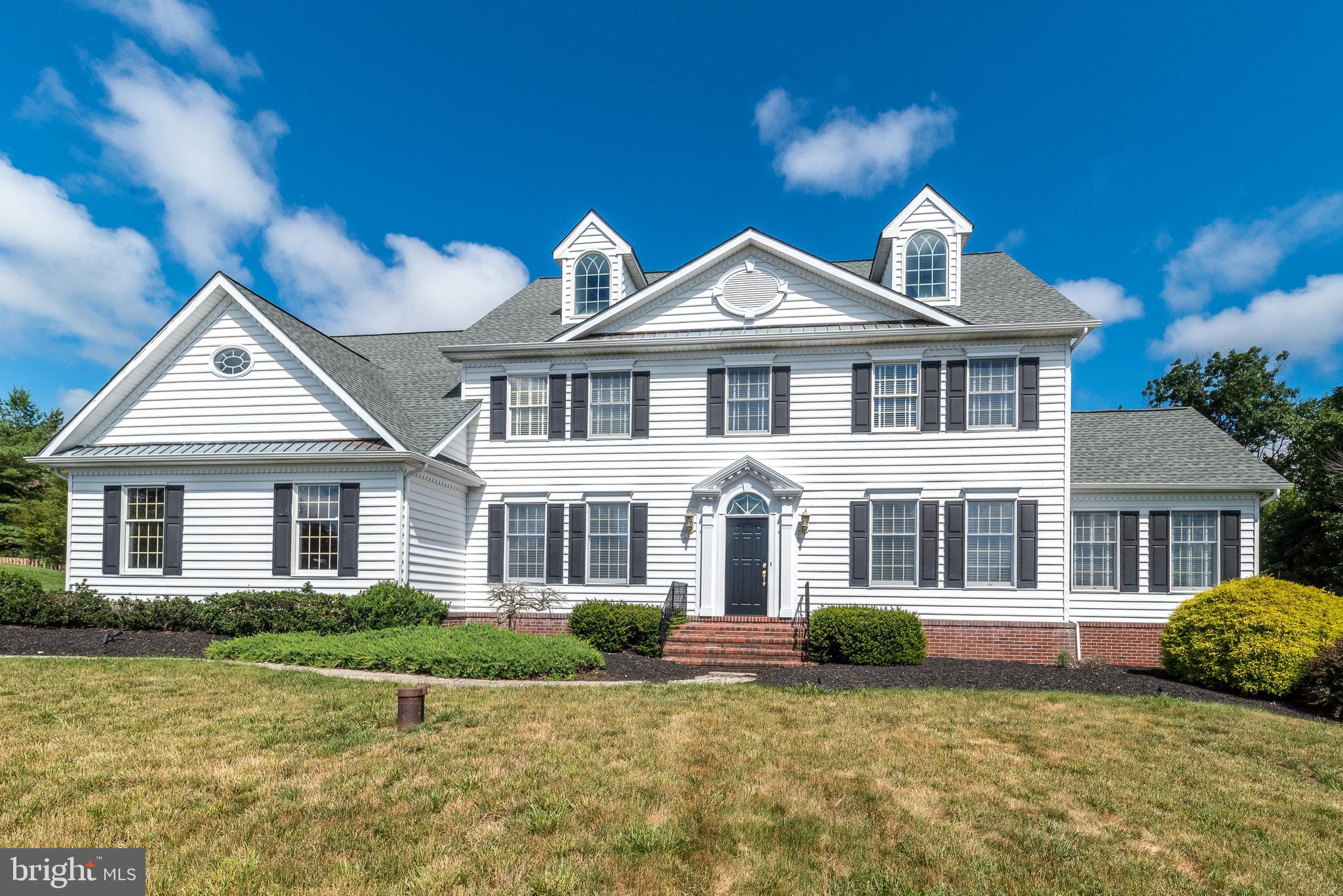 Welcome to "Salford Ridge"  A beautiful Tree lined street is what you'll find as you drive up the hill to this stunning Colonial!  Souderton Schools!  Breath taking views of the Salford Hills!  Attention to detail.  The 1st floor provides plenty of space to live, work & entertain!  Just open the new front door & step into the inviting 2 Story Foyer with it's site finished custom oak floors & a 10 light wrought iron chandelier.  The living room is ready for graceful & elegant entertaining by the gas fireplace with it's Marble surround & Custom "Jefferson" mantle & it's shadowbox wainscotting with chair rail & 3 pice crown molding.  Just off the living room is the Conservatory with it's vaulted ceiling with a lighted fan an abundance of Anderson windows including a Palladiam window with a Gothic grill.   Step out to the large dining room with it's shadowbox wainscotting, chair rail & 3 piece crown molding for all your entertaining needs with a beautiful view of the outside through the large bay window.  The kitchen has beautifully refinished site finished Oak floors.  Custom Cherry cabinets with dental corbels & roping crown molding with under cabinet lighting for just the right touch, topped off with Corian countertops with bullnose edging & Italian Tile backsplash along with a beautiful 6' x3 'granite countertop with speciality edging.  A beautiful 5 burner Kitchen Aid gas cooktop makes cooking easy along with the new Whirlpool microwave over the new large convection oven!  The breakfast room offers a pantry with custom closet system & a brand new sliding door leading to the rear deck,  There's a convenient laundry room with 12x12 Italian tile flooring & a large closet with more custom shelving, a utility tub & Wall cabinets above the washer & dryer.  The family room with it's 2 story Vaulted ceiling has a raised hearth stone gas fireplace flanked by Palladium windows.  Take your pick of either the elegant staircases to assend to the 2nd floor where you'll find the Primary Suite with it's Tray ceiling & a charming Chandelier & Crown molding and a Huge Walk In closet with organizers!  The Primary Bath was recently remodeled & has an enormous walk in shower with 4 shower heads & a large tile bench.  There's a lovely free standing soaking tub with a panoramic view of the back yard, not to worry there's an electric blind that can be closed over the window.  The double vanity has a cultured marbel top, there's a large linen closet & the water closet has a seperate exhaust fan from the bathroom !    The  hall bath has a rainfall shower, tile floor & surround, highhat lighting, a vanity with corian & a large linen closet with organizers.  All Three bedrooms have Crown molding, ceiling fans & custom closet systems.  But One has a Sitting room too!  Yep!  The 16x11 bedroom has a 12x11 Sitting room!  As you decend the front staircase you'll notice the Office with it's glass French doors with transom windows & high hat lighting & 3 pc crown molding & chair rail.  There's also a convenient Powder Room in the hall.  Venture to the finished basement with it's outside exit & you will find a Huge Game Room with an epoxy resin finished floor.  Name Your Game,  There's room for it here!  There's plenty of high hat lighting in these 10 foot ceilings! An Entertainment/Theater Nook with Black out drapes a Screen,  Projector & Speakers included.  A full bath (tile shower with rainhead shower with a vanity & toilet).  A finished room with Chairrail, high hat lighting & baseboard heat. A cedar closet, an unused wine cellar with Control for humidity & temp.  A storage room, a  & a mechanical room with 2 air handlers & 2 electric panels.  Let's head outside to the Trex deck with Gazebos! A beautiful Completely Fenced Inground Pool!  And still enough room for a baseball game!  2 Car Attached & 2 Car detached Garages.  Don't miss the Wooded hiking path that goes to the stream & beyond!