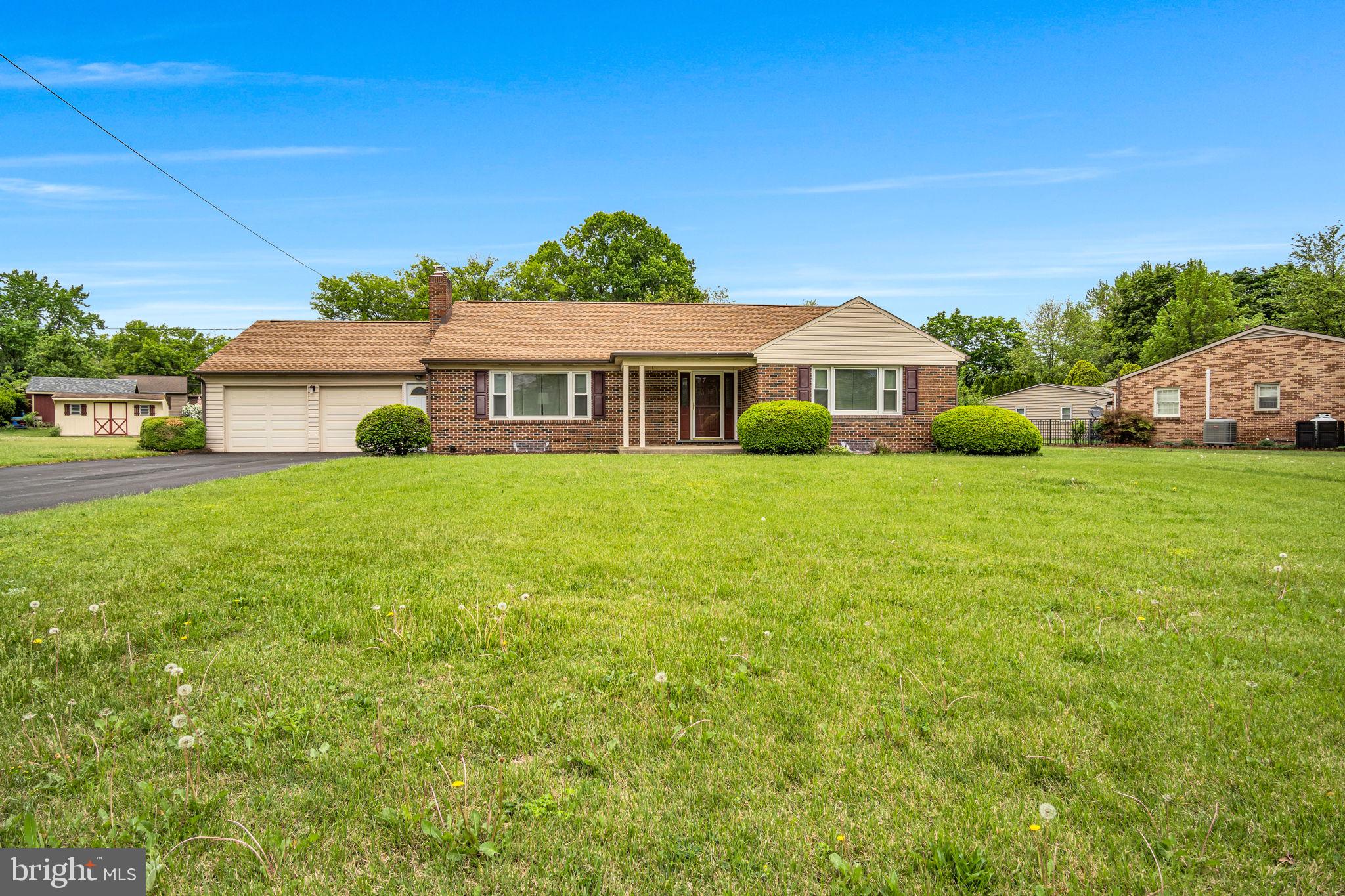 Solid brick construction, a spacious lot, and unbeatable value — this well-maintained 3-bedroom, 2-bath home offers lasting quality you can feel. Built with durable brick that would be costly to replicate today, this home combines craftsmanship with comfort on a beautiful 0.63-acre lot. Nestled in a quiet neighborhood near a local park and just minutes from town conveniences, the property offers the perfect balance of privacy and accessibility.

Inside, you'll find a thoughtful layout with two full bathrooms, laundry hookups both upstairs and in the basement, and a partially finished lower level complete with a second kitchen setup — ideal for extended family, entertaining, or flexible use. Step outside to enjoy the fenced-in backyard, concrete patio, and two storage sheds on a level, beautifully kept lot.

Additional highlights include a 2-car garage, newer roof replaced in late 2019, and the enduring appeal of quality brick construction at a great price. Schedule your showing today!