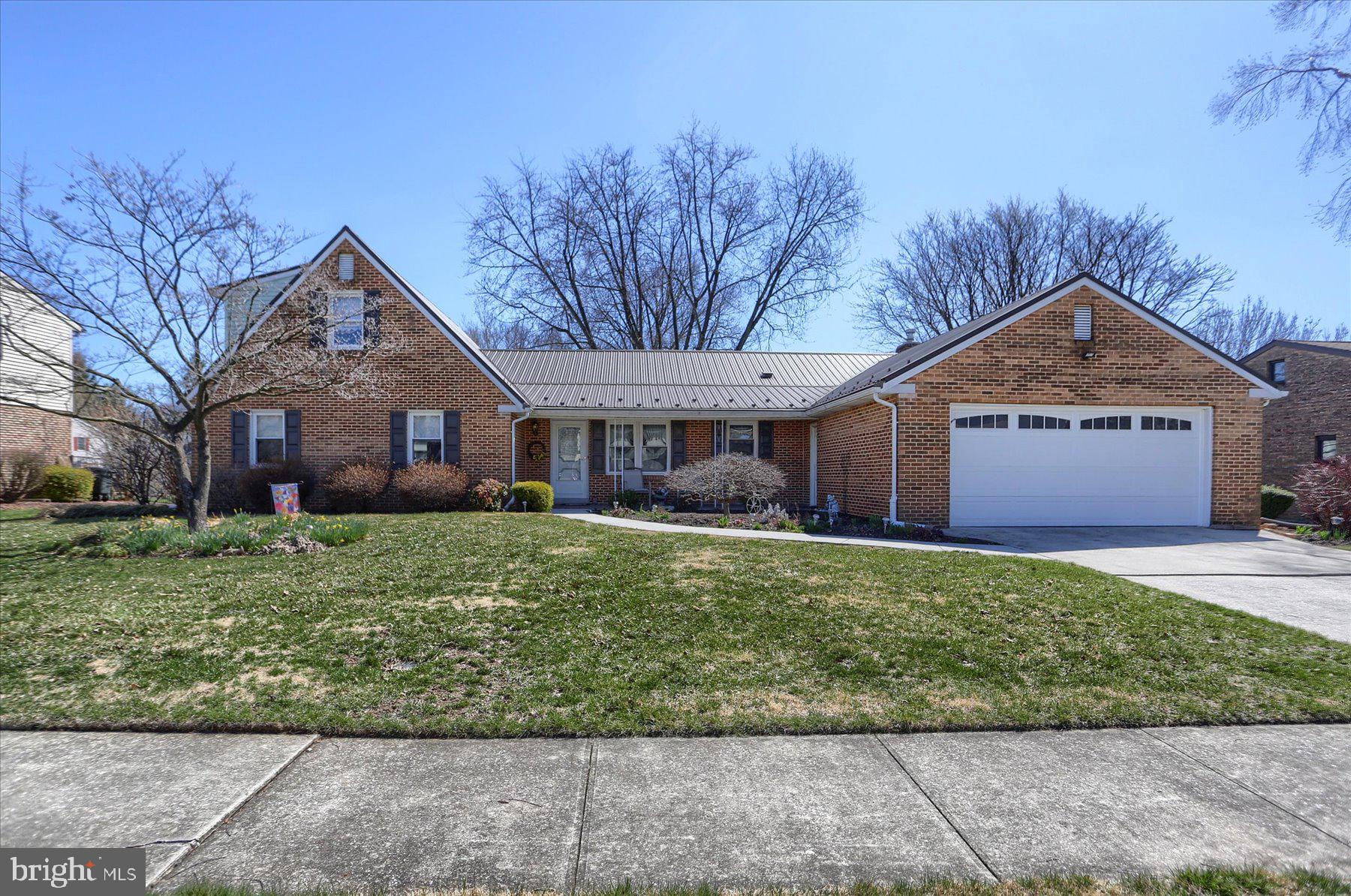 A rare find in a prime location of the Mechanicsburg Borough! Nestled in the highly sought-after Heritage Acres neighborhood, this immaculately maintained custom 5 br/3.5 bath home is a true gem, lovingly cared for by the original owners for 44 years, offering 2,384 square feet of comfortable living space perfect for relaxation and entertaining. The main level is designed for easy, one-level living, featuring a spacious primary suite with a newly updated walk-in shower. Two additional bedrooms share a full bath, making this layout ideal for families or guests. A welcoming covered front porch leads to a bright foyer that opens to a traditional floor plan, including a living room, formal dining room, and a spacious eat-in kitchen, beautifully updated with granite countertops, a tile backsplash, ample storage, and a peninsula for extra counter space. The cozy family room, adjacent to the kitchen, features a gas/lp fireplace, which steps out the sunroom and flows seamlessly onto a composite deck overlooking the manicured backyard. The main level also includes a convenient laundry/mud room off of the garage, which features a private half bath for added functionality and ease. Updates include a metal roof, replacement vinyl windows, HVAC system, flooring, and appliances. The second floor offers two generously sized bedrooms, each with large closets, sharing a full bath and providing additional storage. The partially finished basement features a rec room with a built-in bar and plenty of closet space. The oversized garage (21’x21’) provides plenty of room for two cars and additional overhead storage accessed by pull-down stairs. This home is just minutes from all the amenities Mechanicsburg has to offer, while providing a peaceful, well-established neighborhood setting. Don't miss the opportunity to make 700 Somerset Dr. your new home!