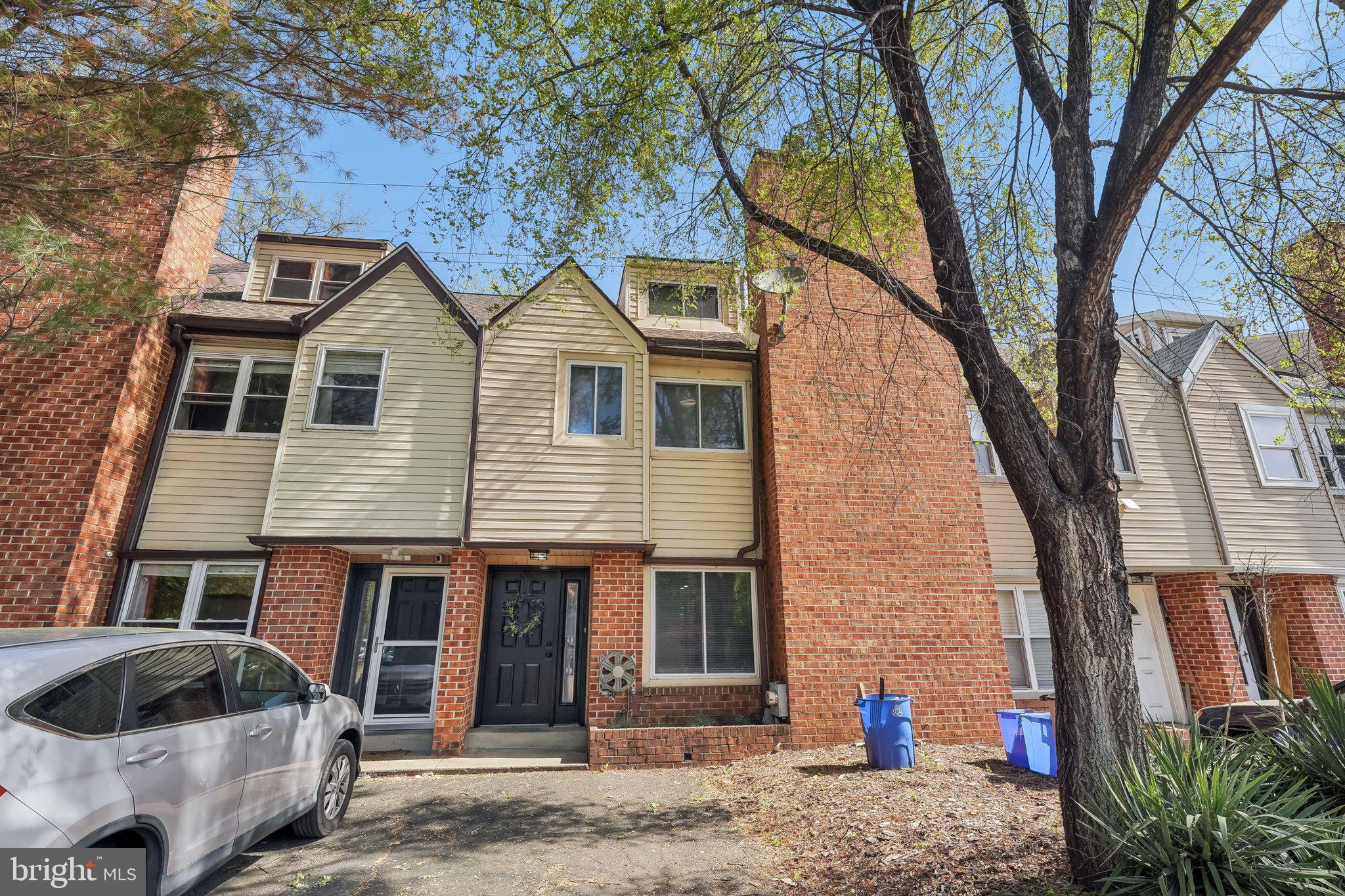 Tucked away on a quiet cul-de-sac in sought-after East Falls, this one-of-a-kind contemporary townhome is a rare find offering exceptional space, privacy, and style. From the moment you enter inside, you'll be impressed by the gleaming hardwood tile flooring and open layout designed for modern living. The inviting main level features a spacious living room with a cozy fireplace—perfect for relaxing evenings. The large eat-in kitchen boasts granite countertops, gas cooking, and plenty of room for a full-size table. Sliders off the dining area lead to your own private back deck and fenced yard, ideal for outdoor entertaining or a quiet morning coffee. Ample closet space and a convenient half bath complete the main level. Upstairs, discover two primary suites with gorgeous bamboo flooring. The front suite boasts custom open built-in shelving and a sleek ensuite with a stall shower. The expansive rear suite is a true retreat with a wood-burning stove, large ensuite bath featuring a soaking tub, walk-in shower, and generous closet space. A hidden gem awaits above: a show-stopping third-floor loft accessed from the rear suite. This versatile space includes its own half bath, built-in counter, custom walled closets, and a walk-in cedar closet—perfect as an additional bedroom, home office, nursery, or creative studio. The possibilities are truly endless. The fully finished basement provides even more flexible living space—ideal for a family room, gym, media area, or guest quarters. Don't miss this rare opportunity to own a distinctive home in a peaceful setting with easy access to Center City, major highways, and all the charm East Falls has to offer.