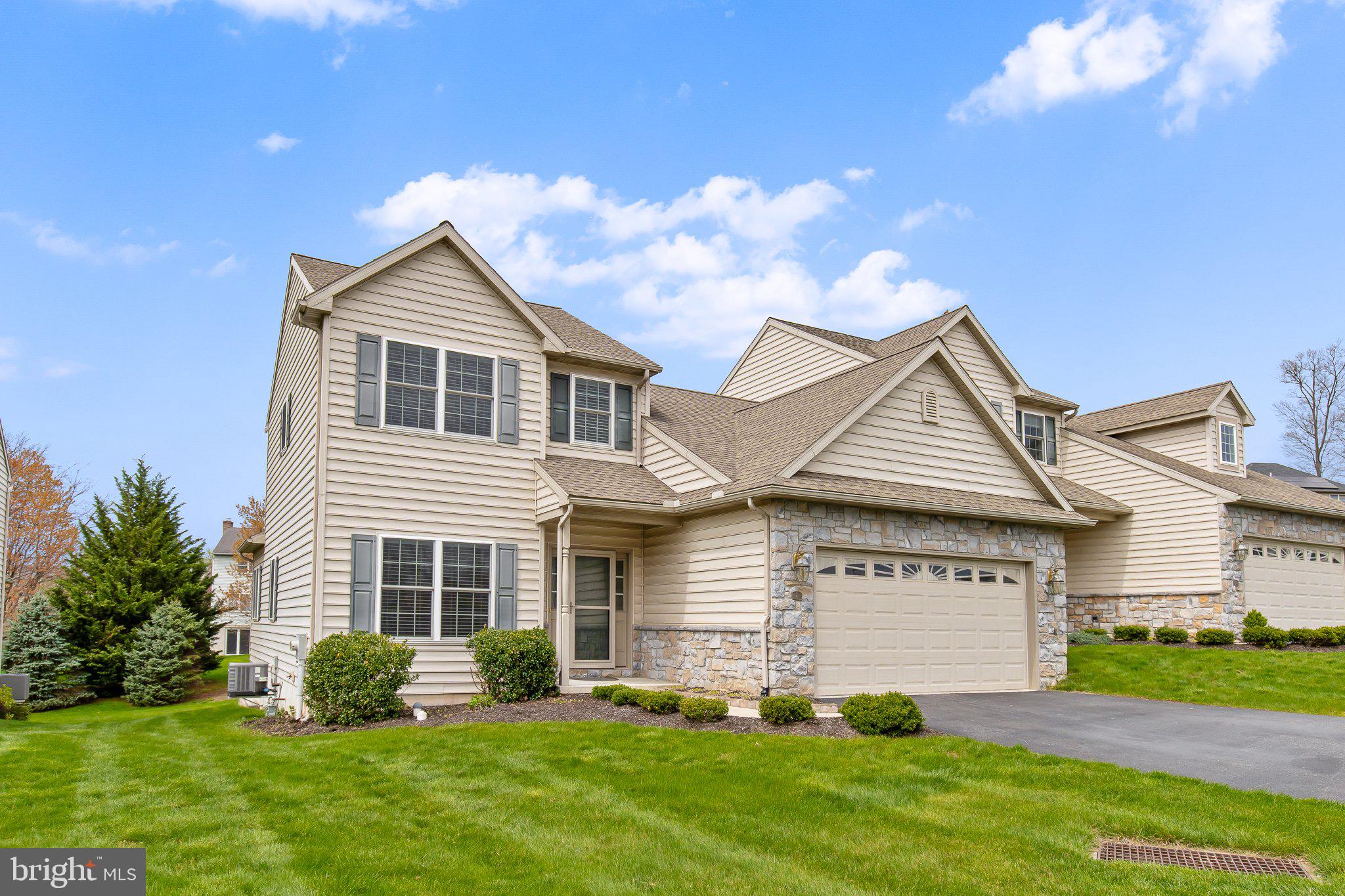 Nestled in the desirable Woods Edge community of Elizabethtown, this former model home seamlessly blends refined design with everyday functionality. Meticulously maintained and move-in ready, it offers a harmonious balance of comfort and sophistication.​ Upon entry, you're welcomed into a spacious living room adorned with gleaming luxury wood vinyl floors and a ceiling fan, creating an inviting atmosphere. The adjacent kitchen and dining area boast quartz countertops, a central island, pantry, recessed lighting, and a built-in desk with hutch—ideal for culinary endeavors and casual gatherings.​ A sunroom with a vaulted ceiling and a ceiling fan provides a serene retreat, perfect for relaxation or entertaining. The main level also features a primary bedroom suite with an en-suite bath, a convenient powder room, and a laundry room for added practicality.​ Upstairs, two additional bedrooms with walk-in closets and a full bath offer ample space for family or guests. The unfinished walkout lower level featuring daylight windows presents a blank canvas for your creative vision.​ Outdoor living is enhanced by a composite deck, as well as a patio equipped with a retractable awning, providing comfortable spaces for your enjoyment. A two-car garage with additional storage space completes this exceptional residence.​ Schedule your showing for this distinguished Woods Edge home today!