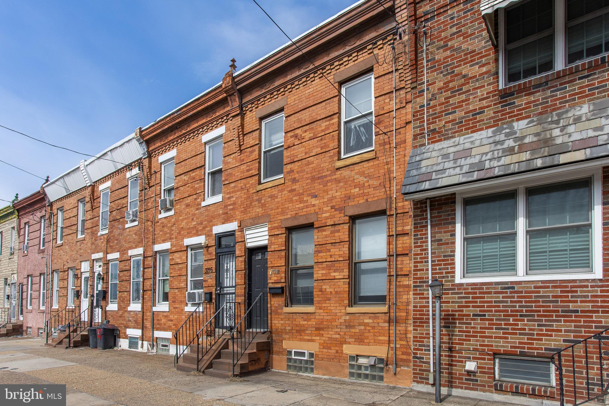 Welcome to 3218 Aramingo Avenue, a 2-bedroom, 1-bath rowhome in Philadelphia. As you approach the home, a few steps lead to the front entry. Inside, you’re welcomed by a bright living room with hardwood floors that flows into the dining room, also featuring hardwood flooring and access to the basement. Just beyond, the kitchen offers tile flooring, wooden cabinetry, stainless steel appliances, and a door leading to the private fenced-in yard—providing a great outdoor space for relaxing or entertaining. Upstairs, the second level includes two bedrooms, one with hardwood flooring and the other with tile flooring. The full bathroom features tile floors, a single-sink vanity, and a tiled tub/shower combination. The unfinished basement offers additional storage and the potential for future living space. Conveniently located near local shopping, grocery stores, and restaurants, this home also provides quick access to I-95 for easy commuting. Don’t miss the opportunity to make 3218 Aramingo Avenue your own.