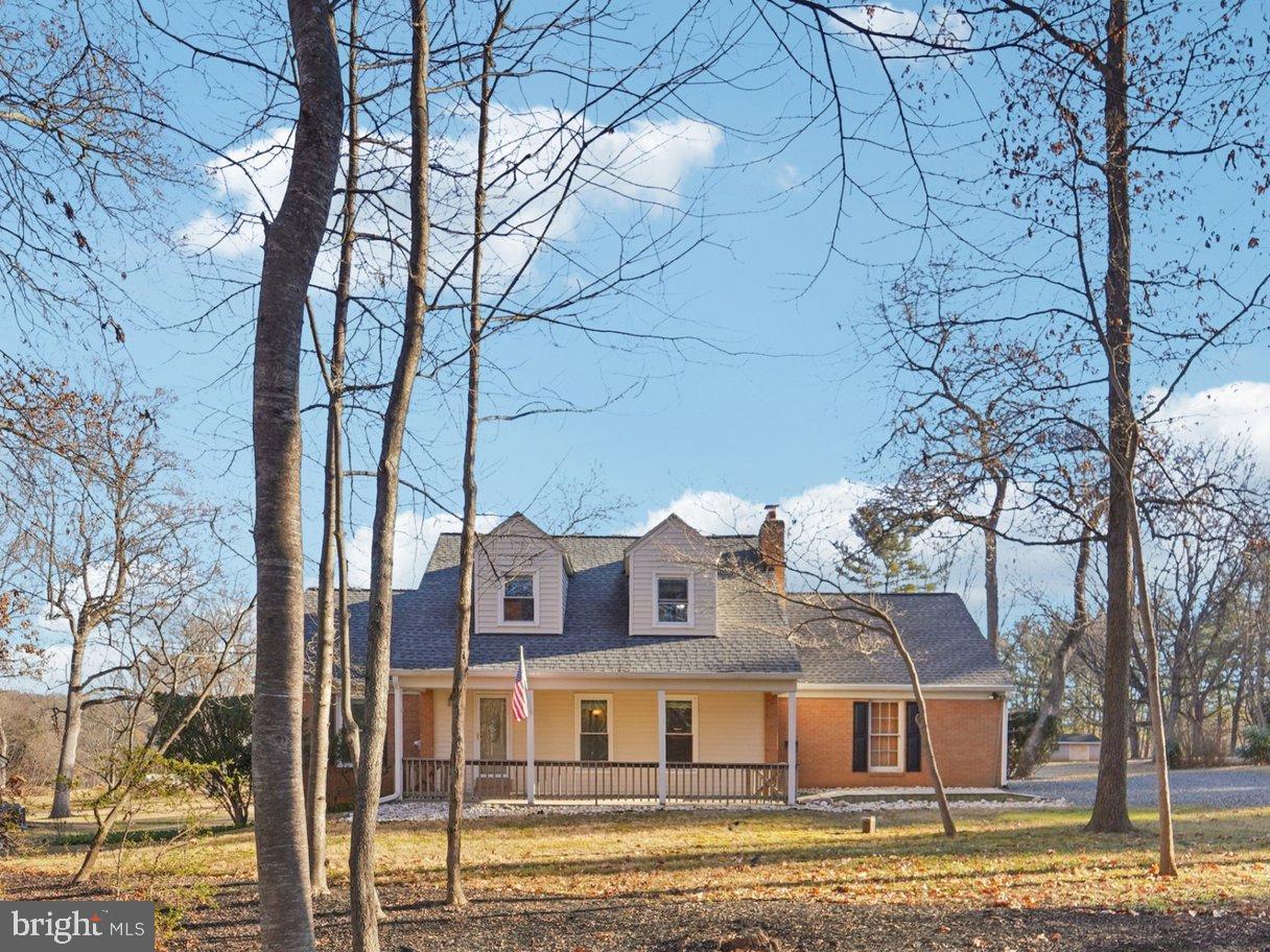 Set on nearly one acre in sought-after Highland, this thoughtfully renovated Cape Cod offers flexible living spaces, scenic views, and a layout designed to support both everyday living and evolving lifestyle needs. Located within highly rated Howard County school assignments, the property combines privacy, space, and accessibility in one of Western Howard’s most desirable settings.

The main level is designed with distinct yet connected living areas, creating flexibility for a variety of lifestyles. Living room, dining room, and kitchen flow naturally into a sunroom with expansive rear-yard views. A side entry with drop zone enhances everyday functionality. Additional main-level living areas provide excellent options for first-level living, guest accommodations, or dedicated work-from-home space, supported by a convenient full bath on the main level. The four-season room overlooks the brick patio and backyard, serving as a light-filled extension of the main living space that enhances both flow and versatility.

The upper level includes three bedrooms and two full baths, highlighted by a primary suite with private ensuite bath.

The finished walk-out basement further expands the home’s functional footprint with a recreation room, entertainment area with bar, and an additional flexible room suitable for office, hobby, or fitness use.

Approximately 2,200 finished square feet (tax records may not reflect the finished four-season room). Major systems have been updated, including energy-efficient VRF heating and cooling with backup oil heat, a roof approximately six years old, and windows approximately nine years old.

Additional highlights include a one-car attached garage, new interior paint, distinctive custom stained glass and etched windows, a cozy wood-burning fireplace, brick patio, and expansive lot offering privacy and outdoor enjoyment.

Located in desirable Highland, known for its scenic landscapes and spacious properties, this home offers a rare balance of rural character and commuter convenience. Enjoy close proximity to Maple Lawn shops and dining, River Hill Village Center, Clarksville Commons, and Columbia Town Center. Easy access to Route 32, Route 29, and I-95 provides convenient commuting to Baltimore, Washington, DC, and major employment centers including Johns Hopkins Applied Physics Laboratory (APL), Fort Meade/NSA, and Columbia’s growing corporate and healthcare corridor.

Seller prefers to sell As-Is. Mortgage savings may be available for qualified buyers.