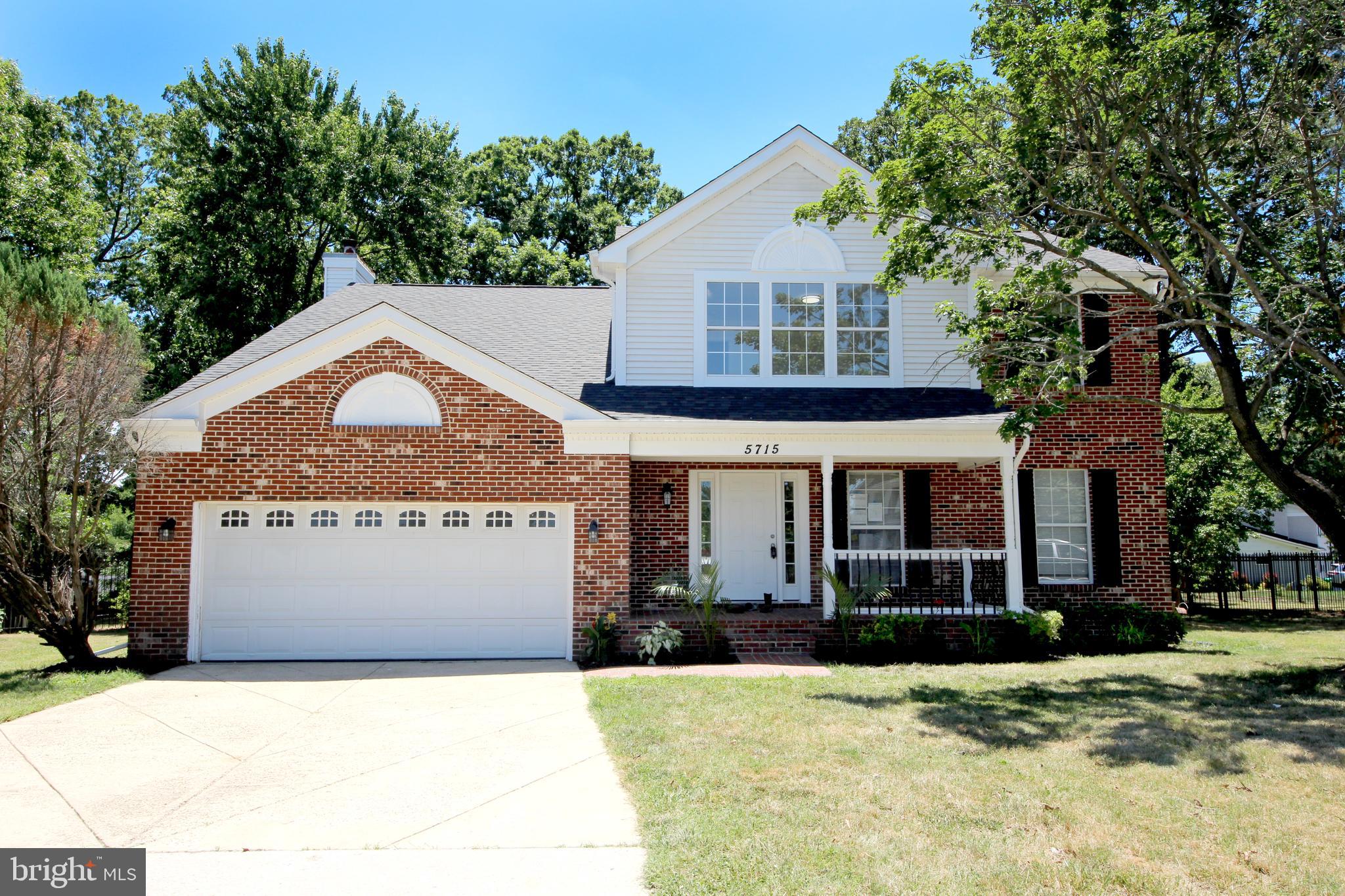 MUST SEE this STUNNING, ELABORATE CUSTOM FINISHES!! 3 LEVEL, 4 BEDROOM,  2 FULL BATHS, 2 HALF BATHS Brick/Siding HOME with Landscaped Yard!  ALL NEW: DOORS Interior and Exterior. ALL NEW GOURMET EAT-IN KITCHEN WITH NEW HI-END Wood Cabinets, ALL NEW STAINLESS-STEEL APPLIANCES, Four Door Frig with Water and Ice,  EXOTIC GRANITE with  BACKSPLASH. Living Room, Family, Dining Room and Main Hall with GLEAMING Wood Floors, NEW Hi-End Light Fixtures, Chair-Rail Moldings and CUSTOM 2-Tone Paint. ALL NEW BATHS with CUSTOM VANITIES, LIGHTING, and Mirrors with EXQUISITE PORCELAIN TILED Walls and Floors. Upper Level Includes Four Spacious Bedrooms. Fully Finished Lower Level INCLUDES a HUGE Rec Room, Bathroom, Mechanical Room and Laundry Area. ****Walk Out from the Kitchen or Lower Level to Entertain in your Impressive backyard with Large Deck and Gazebo.  Large DRIVEWAY  and Two Car Garage**** NEW WATER HEATER. ONE YEAR HOME WARRANTY (Paid by the Seller at the Closing).