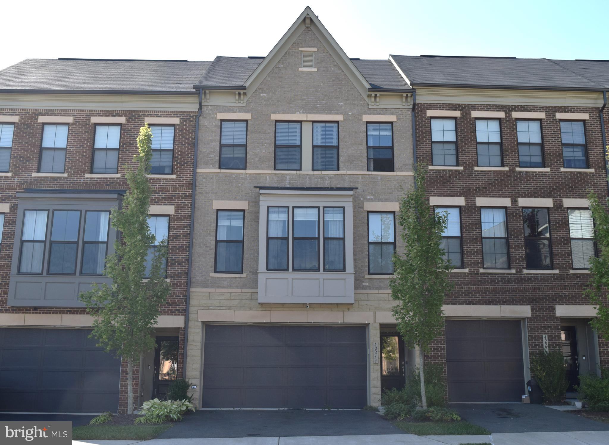 This beautiful, Spacious, 3 Bedroom, 3 and Half Bath , 2 Car Garage , Townhouse in sought after Brambleton Area with Brambleton HOA Amenities. Sun-filled Miller & Smith townhouse is close to the Brambleton Corner Clubhouse & Pool and the Brambleton Performing Arts Center and two miles of the Brambleton Town Center shops, Cinema & restaurants.  Open Floor Plan on the Main Level with Living, Dining, Kitchen and  Full Deck for entertaining. The Beautiful Contemporary Kitchen with Huge Island features Granite Counter , Stainless Steel Appliances, Dining Area .  Half Bath on Main Level. The Upper Level Has Carpeted Bedrooms, with a Spacious Master Bedroom, with Huge Walk in Close,  Master Bathroom with Double Vanity and Huge Sower Area.  Two additional nice-sized bedrooms, a second full bathroom, and a laundry room complete this floor. The Basement  recreation room , has a third full bath, perfect space for watching movies/game nights  or for a private home office, ideal for those work-from-home. Walk Out to Patio Area, perfect area for Barbeque.  This home also has a two-car garage, 2 Car Driveway  and plenty of guest parking spots. There is a Beautiful Courtyard and Tot Lot/Kids Play Area right in front of this Property.  The new Metro station is about 10-minute drive, The Brambleton HOA fee includes Basic Verizon FIOS Internet, Cable TV. Easy access to Loudoun County Parkway, Dulles Toll Road/267, Dulles Airport, Rt.50, Gas Stations. Long & Foster Realtors online application to apply.