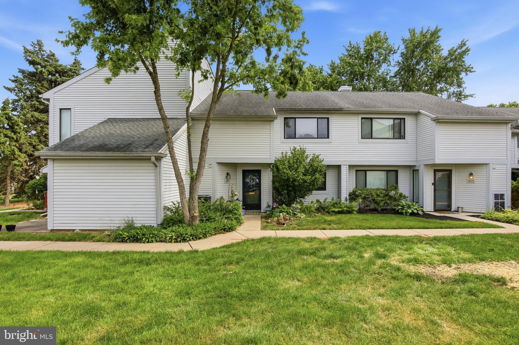 Welcome to 404 Bunker Hill Road in the highly desirable  Towamencin Condominium Community! This spacious three-bedroom, two-and-a-half-bath home is the largest model available in the neighborhood and offers a rare combination of space, convenience, and value.
A beautifully landscaped front entry sets the tone as you step inside to a bright and inviting living room and dining area featuring newer luxury vinyl plank flooring. The kitchen is equipped with stainless steel appliances, including a new dishwasher, and flows seamlessly into the cozy den. A sliding glass door leads to a private patio overlooking open community green space—an ideal spot to relax or entertain.
The first floor also features a convenient laundry area, two large storage closets, and a powder room.
Upstairs, the spacious primary suite offers a large 11’ x 3’ closet and a private bath. Two additional generously sized bedrooms and a hall bath complete the second level. Pull-down attic stairs provide access to additional floored storage space.
Adding to the appeal is an assigned parking space plus a rarely offered separately deeded one-car carport #21 with an attached storage locker #1 —an exceptional feature in the community.  HVAC replaced in 2025!
Residents enjoy access to community amenities including a swimming pool, basketball court, and playground. Conveniently located just minutes from the Merck campus, shopping, dining, and the Northeast Extension of the Pennsylvania Turnpike, this home offers easy access to everything you need.
Don’t miss this opportunity to own one of the largest and most desirable floor plans in this sought-after community!