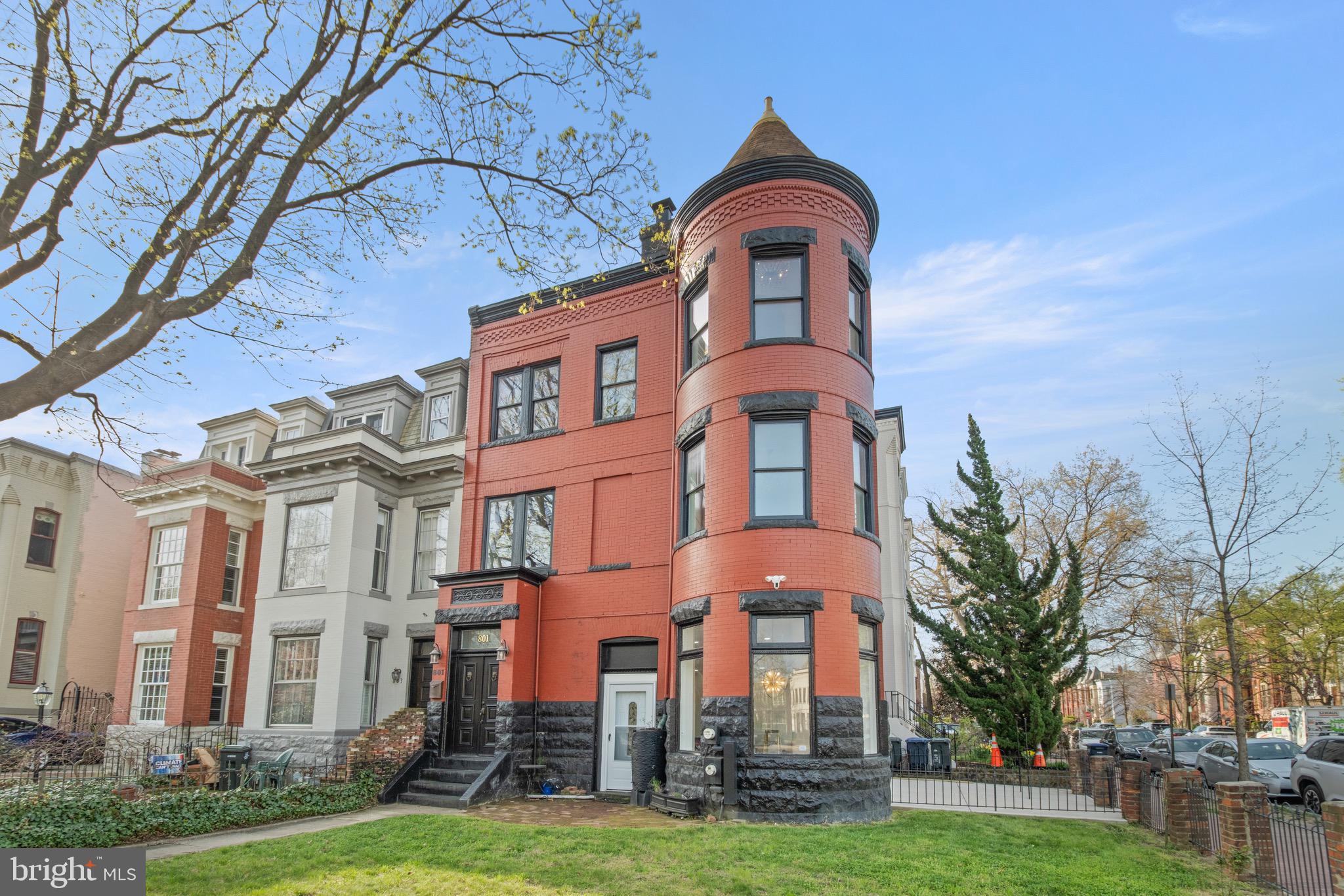 On a distinguished stretch of East Capitol Street, where Washington's architectural legacy is most vividly preserved, 801 East Capitol Street SE anchors its corner with quiet authority. Defined by its sculptural turret, nuanced brickwork, and a silhouette that feels at once romantic and resolute, the building presents a compelling mixed-use investment with a range of possibilities. The ground floor and basement provide well-proportioned commercial space, suited for a discerning retailer, private office, or creative practice seeking prime corner exposure.

A separate entrance leads to an expansive two-bedroom, one-and-a-half-bath residence of generous proportions. The second floor is devoted to an open living area and kitchen, with bright, well-scaled rooms. The third floor retreats to two well-appointed bedrooms, the building's distinctive curved turret lends an air of architectural character. Steps from Lincoln Park and within reach of Eastern Market, this is a rare opportunity to acquire a property of enduring quality in one of Washington's most sought-after neighborhoods.