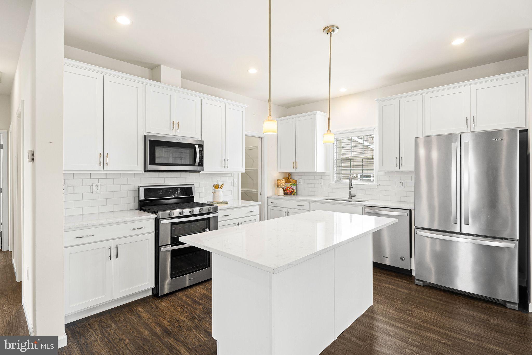 Sometimes a home represents more than a move—it represents a fresh start.

Built in 2020 and thoughtfully upgraded with more than $25,000 in enhancements, this former model home offers a bright, open, and welcoming alternative to the larger, high-maintenance homes many buyers are leaving behind. From the moment you step inside, you'll notice what makes this home different: soaring ceilings, abundant natural light, and an open-concept design rarely found in this community.

At the center of the home is a beautifully appointed kitchen featuring 42" white cabinetry, granite countertops, upgraded appliances, an oversized center island, and a spacious walk-in pantry that provides exceptional storage without sacrificing style. The seamless flow between the kitchen, dining, and living spaces creates an ideal setting for both everyday living and holiday gatherings with family and friends.

The spacious primary suite offers a peaceful retreat with a private bath featuring a double vanity and walk-in shower, while a second bedroom and full bath provide comfortable accommodations for guests.

Outside, enjoy morning coffee or evening conversation on the covered front porch with low-maintenance composite decking. The two-car driveway, attic storage access, and thoughtfully designed floor plan make everyday living easy and efficient.

Perfectly positioned within the highly desirable 55+ community of Blue Bell Springs, this home enjoys one of the community's most desirable locations, away from the commercial surroundings that impact some neighboring properties. Residents appreciate the friendly atmosphere, beautifully maintained grounds, and convenient access to shopping, dining, healthcare, and major roadways.

If you've been searching for a home that offers less maintenance, more enjoyment, and a space that truly feels open, bright, and move-in ready, 420 Dandelion Drive may be exactly the fresh start you've been waiting for.