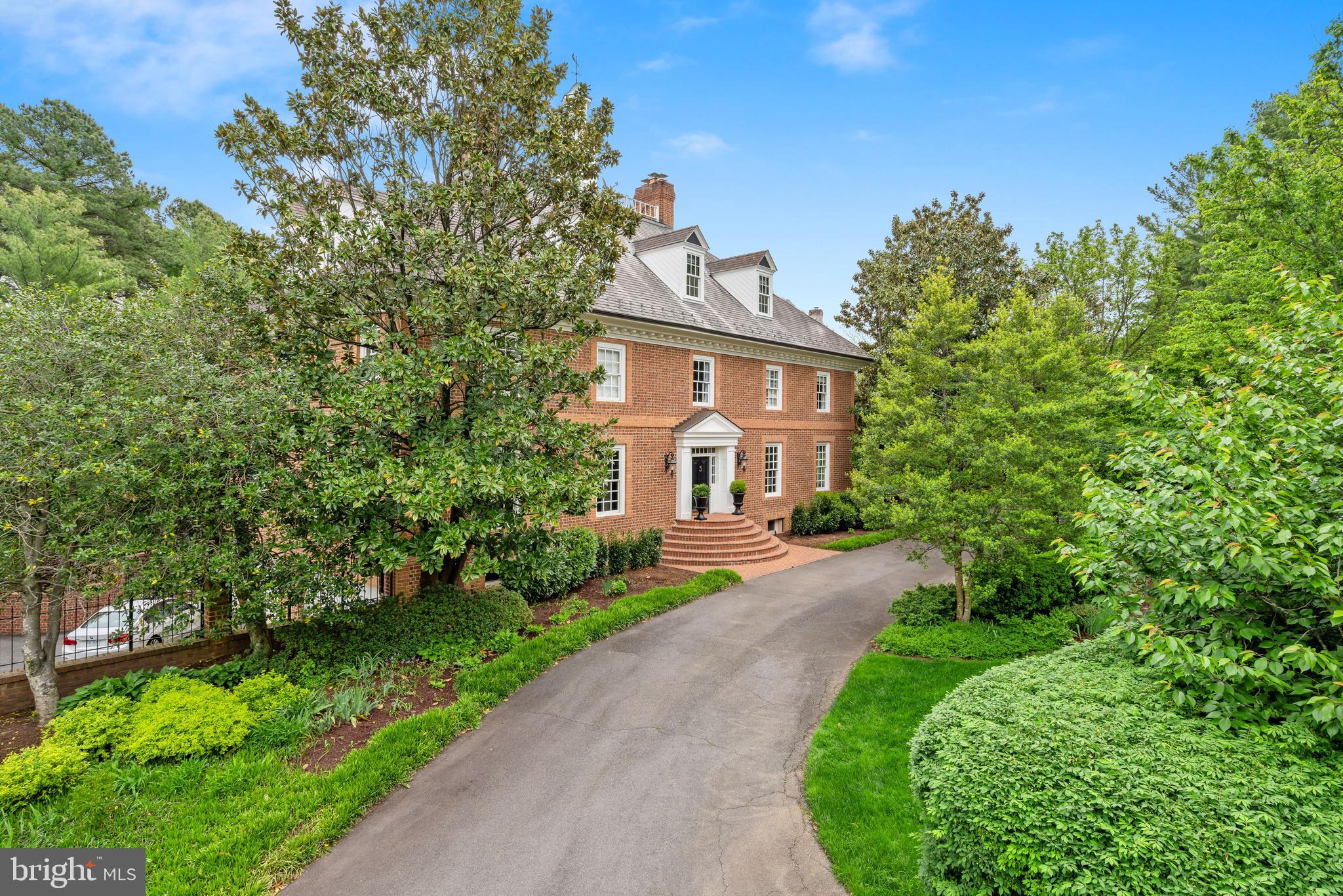 Sophisticated all brick Colonial conveniently located in between DC and Tysons! Beautifully detailed interior includes the chef's Kitchen with heated floors, custom cabinets, two center islands and high end appliances. A two-story Family Room is adorned with a fireplace, beamed ceiling, Palladian windows and French doors that provide access to the Terrace overlooking the picturesque Backyard. Upstairs is the Owner's Suite with a cozy Sitting Room, fireplace and Spa Bath with heated floors, separate vanities and spacious walk-in Closet. Additionally, there are 3 Bedrooms on the upper level and another two in the 3rd Level with a spacious Play Room. The walk-out Lower Level is complete with a Recreation Room with a fireplace, Kitchenette, Bedroom, Mud Room, Laundry Room, Pool Towel Room and Bath. A private terrace with pool is surrounded by mature landscaping and is perfect for al-fresco dining and entertaining!