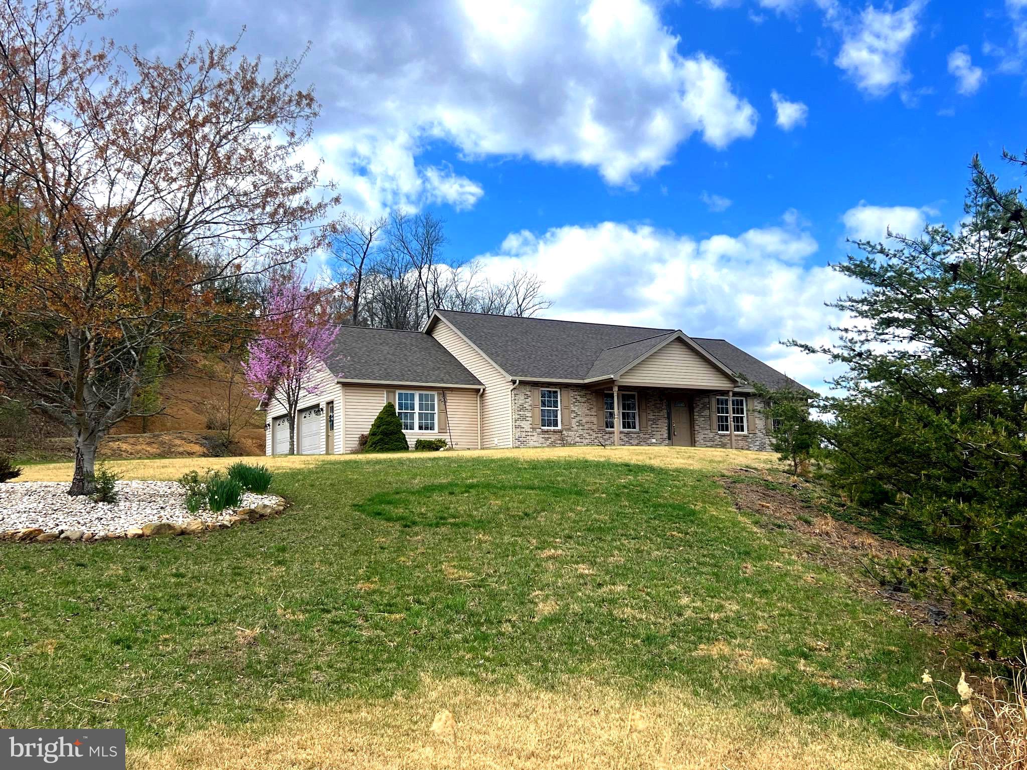 Rare find in the highly sought-after Lakewood subdivision! This spacious ranch-style home sits on an above-average .96-acre lot and offers beautiful seasonal lake views along with a peaceful mountain setting. Inside, you’ll find an  open-concept layout  featuring a large living room, kitchen, and dining area—perfect for entertaining and everyday living. The  private primary suite is located on its own side of the house including a walk-in closet and a luxurious ensuite bathroom with an  updated walk-in shower, soaking tub, and separate water closet. On the opposite side of the home,  two generously sized bedrooms share a convenient  Jack-and-Jill full bathroom.  A dedicated office with a built-in desk provides the ideal space for working from home or managing daily tasks.  Or convert to another bedroom.  Just off the kitchen, you’ll find a  spacious laundry room and access to the  bonus room above the two-car garage, which is currently being used as an additional bedroom. The garage also offers  ample storage space. The outdoor living areas truly make this property special. Relax on the covered front porch with seasonal lake views, or unwind on the  covered back porch overlooking the flat backyard, creating your own private mountain oasis. Homes like this are hard to find—schedule your showing today before it’s gone!