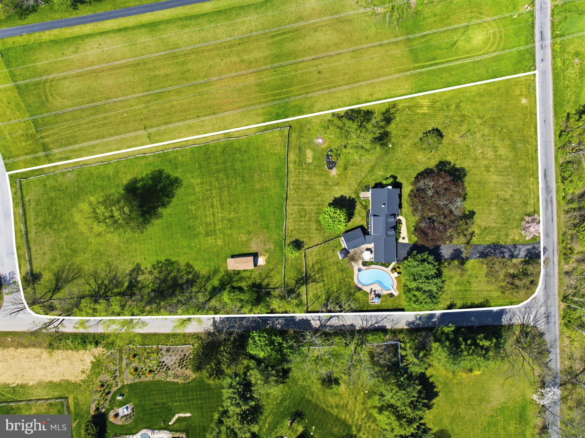 Welcome to 302 Lucky Hill Road—an inviting split-level home set on three acres of flat, open land. Step into the foyer and you’re immediately greeted by a sun-filled living room to your left, highlighted by a large bay window that fills the space with natural light. Continue down the hall past the home office to the eat-in kitchen, complete with a wet bar and convenient access to the two-car garage. Just beyond, the large sunroom offers stunning views of the backyard and the 12’ deep in-ground pool—an ideal space to relax or entertain. From the kitchen, head downstairs to a cozy family room featuring a wood-burning fireplace. This level also includes a generously sized half bath, laundry and utility room, and direct access to the backyard. Upstairs, the third floor holds three bedrooms and two full bathrooms. A short flight up leads to the private main bedroom located on the fourth level, offering a peaceful retreat. With over 3,000 square feet of finished living space, this home truly shines both inside and out. The outdoor setting is perfect for entertaining—whether you’re swimming, grilling, or enjoying the sunset views across the picturesque property. Equestrian enthusiasts will appreciate the fenced horse pasture and small barn. Adding to its appeal, the property sits directly across from Stroud Preserve, where you’ll find 571 acres of protected land and more than 9 miles of scenic trails—perfect for hiking and enjoying nature. Located within the West Chester Area School District and just minutes from the historic Village of Marshallton, as well as downtown West Chester and Downingtown, this home offers the ideal blend of privacy and convenience.
