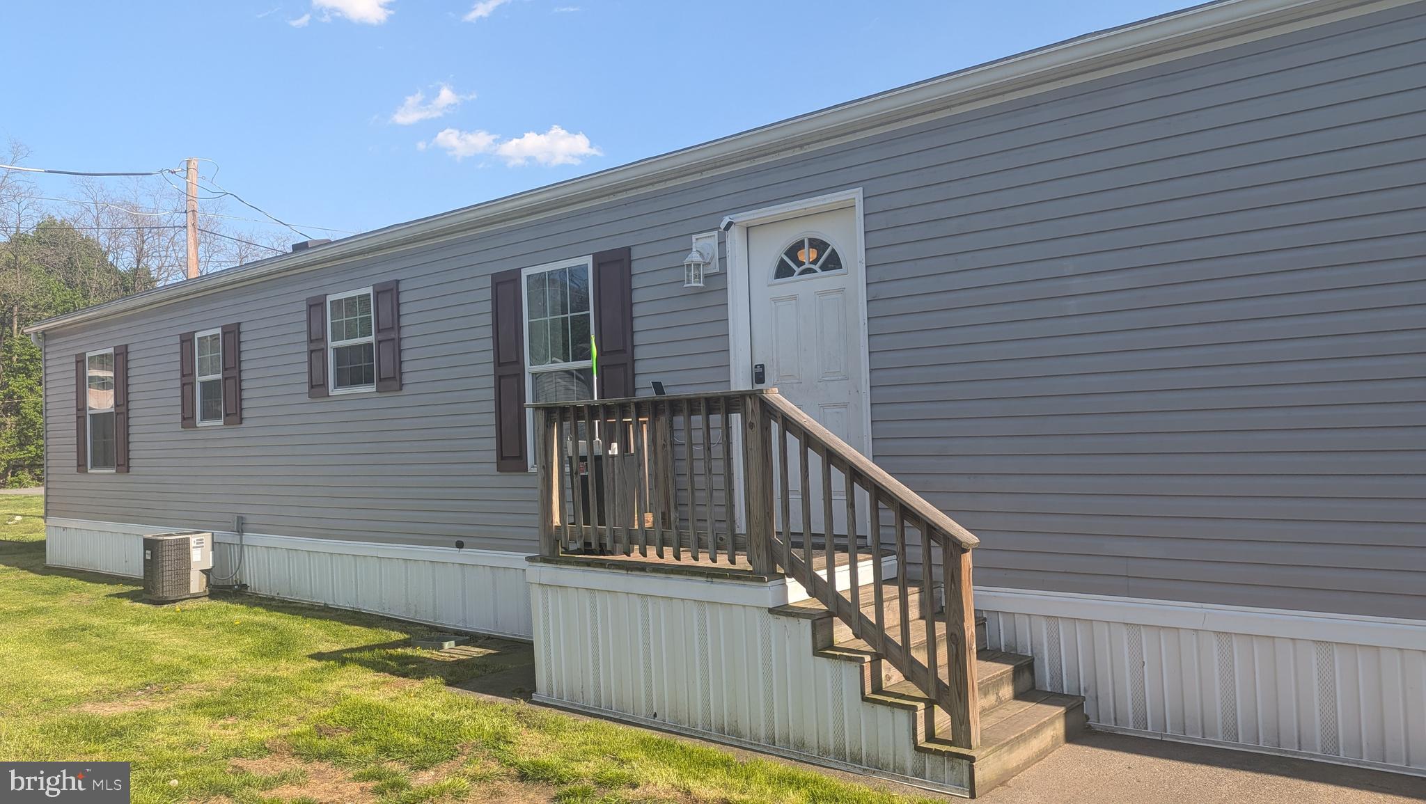 55 plus community in Newport, the Capital of Perry County. One person must be 55 or older to reside in the park. Home is almost new only lived in for two years, three bedrooms, two full baths, color tones of light grey and plenty of windows for natural light. Propane heating with central air, 1 bathroom has a walkin shower. Property will include gas stove,  microwave, fridge, dishwasher, washer, dryer and shed. Crown molding, vinyl flooring throughout, curtains will remain for your convience, island bar, main wall in living room room re-done with wood- woodclad wall. This is a much see. This home is in a park and will require mobile home financing, local financing or a cash buy. Must be park approved.