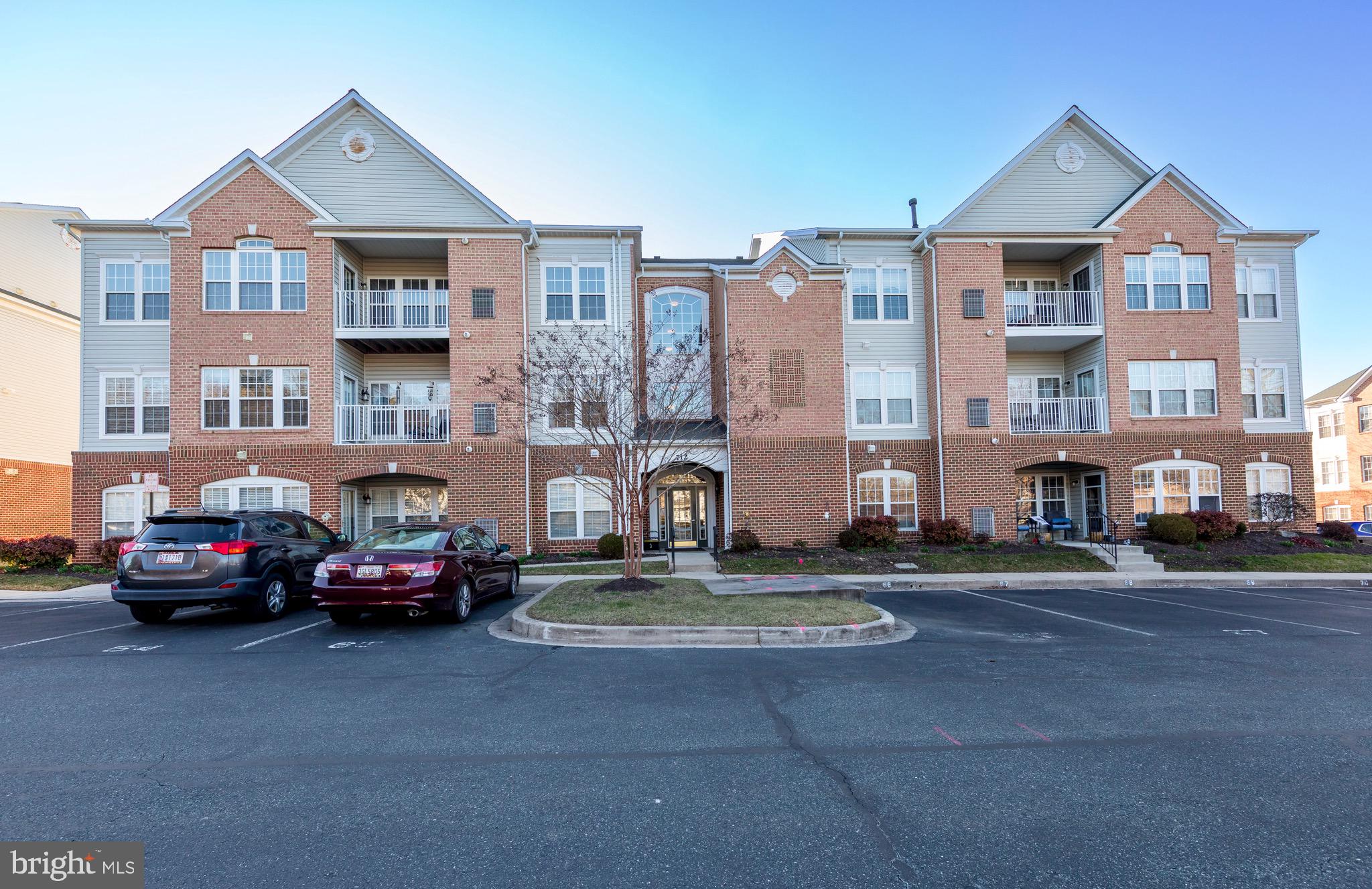 LIGHT STREAMS IN TO THIS  TURN-KEY LUXURY PENTHOUSE CONDO IN THE VIBRANT 55+ COMMUNITY OF KINGS CROSSING, WITH SECURE ENTRANCE AND ELEVATOR!  CONVENIENTLY LOCATED TO SHOPPING, RESTUARANTS AND WALKING TRAILS, THIS HOME FEATURES 2 BEDS AND 2 FULL BATHS, AN OPEN FLOOR PLAN WITH CATHEDRAL CEILINGS, A SEPARATE DINING ROOM WITH CROWN AND CHAIR MOLDINGS, AND A PRIMARY BEDROOM SUITE WITH SITTING ROOM, WALK-IN CLOSET, AND ENSUITE BATH WITH DOUBLE VANITY. EAT-IN KITCHEN BOASTS 42" CABINETS, CORIAN COUNTERTOPS, BREAKFAST BAR, AND NEW DISHWASHER (2026). ENJOY ALMOST 1600 SQUARE FEET OF LIVING SPACE, A LARGE IN-UNIT STORAGE CLOSET AS WELL AS ADDITIONAL STORAGE IN THE HALLWAY. HARDWOOD IN THE FOYER AND EAT-IN KITCHEN ADDS AN UPSCALE TOUCH. THIS HOME IS READY FOR YOU TO MOVE IN -- FRESH PAINT AND CARPET THROUGHOUT! (2026) NEW WATER HEATER (2024). RECENT HVAC SERVICE (2026). NEW WASHER AND DRYER (2026). NEW FLOORING AND SHOWER HEAD IN ENSUITE BATH (2026).  IN ADDITION, GET SOME FRESH AIR AND RELAX ON THE COVERED BALCONY, WHICH HAS A NEW STORM DOOR (2025) AND DECK (2025), OR TAKE A STROLL THROUGH THE COMMUNITY COURTYARD AND GAZEBO. A NEW LIFESTYLE OF COMFORT AND CONVENIENCE AWAITS YOU - DESIGNATED PARKING WITH OVERFLOW, AND ALL THE SERVICES PROVIDED BY THE COMMUNITY TO MAKE YOUR LIFE EASY, INCLUDING LAWN CARE, WATER, SNOW REMOVAL, AND TRASH SERVICES. BOOK YOUR SHOWING TODAY - THIS ONE WON'T LAST!