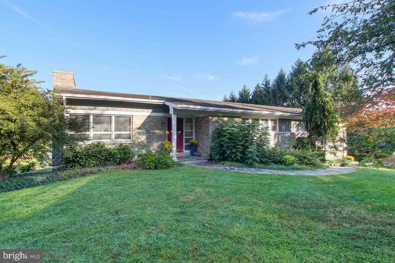 This extremely well-constructed, impeccably maintained, classically designed Mid-Century Modern home is deceptively large. Located in the heart of Wyndham Hills. Low-maintenance, mature landscaping, real stone construction and a perfect layout for entertaining. Large private pool and deck accessible from lower level FR and 2nd Kit.  Lower level BR suite. Perfect for in law quarters. Separate entrance.