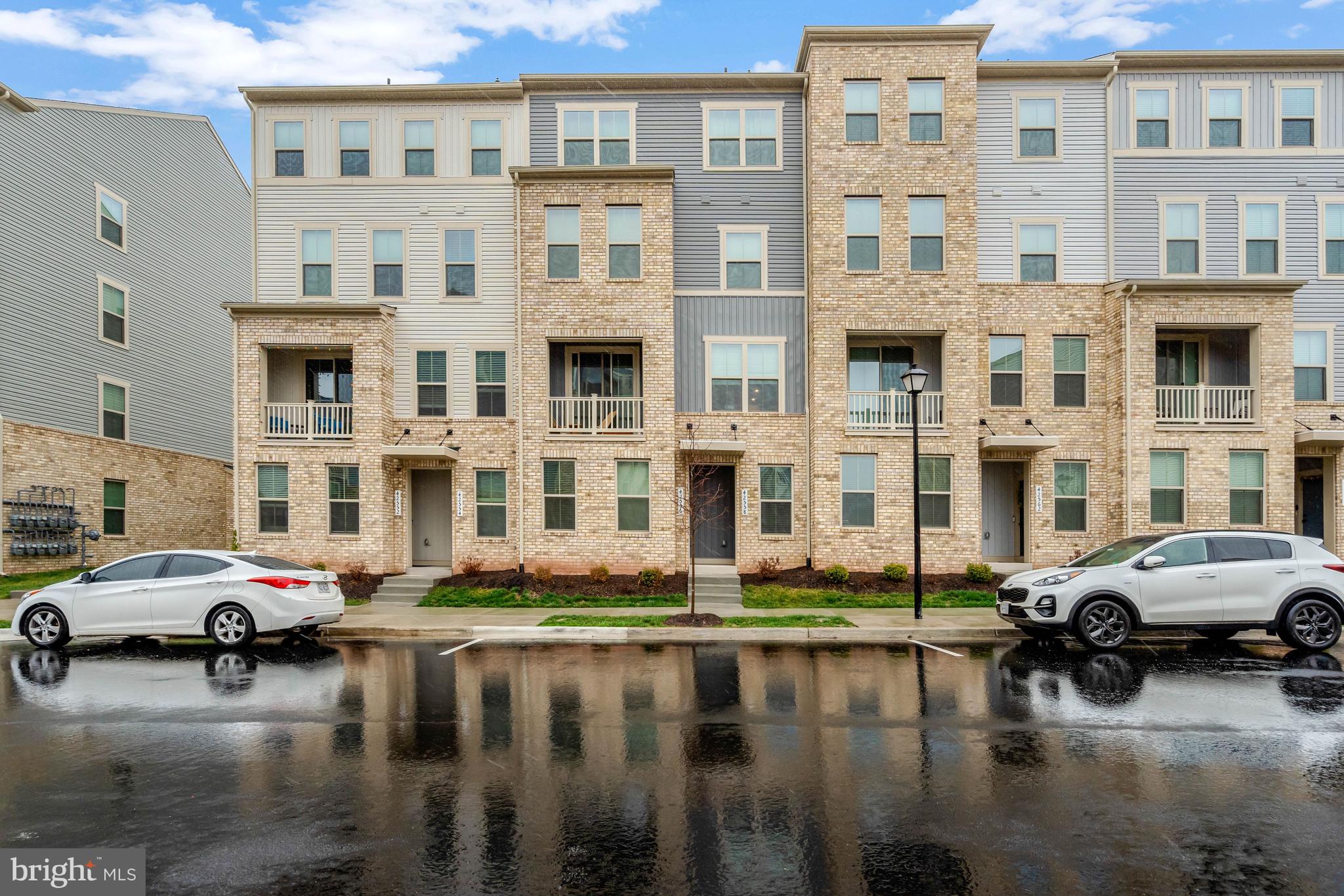 Welcome to 42558 Invergordon Terrace
Experience modern, low-maintenance living in this almost-new 4-level townhome-style condo with no neighbors above or below. Thoughtfully designed with today’s lifestyle in mind, this stunning Juliet model offers flexible living spaces, contemporary finishes, and an ideal location in sought-after Arcola Town Center.
The entry level features a one-car garage, a convenient powder room, and a versatile flex space perfect for a home office, gym, playroom, or bonus living area.
Upstairs, the bright and open main level is made for everyday living and entertaining, a spacious great room, dedicated dining area, and a gourmet kitchen with a large center island, modern cabinetry, and stylish finishes. Step outside to the private deck — the perfect place to relax, dine outdoors, or enjoy your morning coffee.

The third level is dedicated to the luxurious owner’s suite, complete with a walk-in closet and spa-inspired bath with dual vanities.
The top floor offers two additional bedrooms and a full bath, providing plenty of space for guests, remote work, or growing households.
Located in the vibrant mixed-use community of Arcola Town Center, residents enjoy exceptional amenities including a pool, clubhouse, tot lots, and walking paths — all just minutes from shopping, dining, major commuter routes, and Dulles Airport.
Move-in ready and beautifully maintained, this home offers the fresh feel of new construction with the comfort, space, and convenience today’s buyers are looking for.