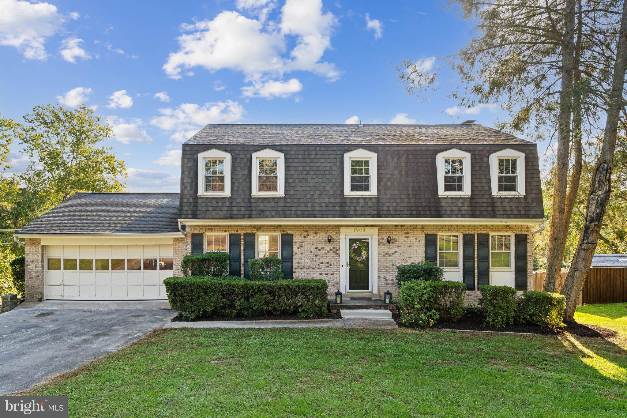Welcome to 10613 Green Dr., Lorton, VA – a stunning Dutch colonial home on the shores of Massey Creek in the desirable Harbor View neighborhood. This elegant property offers modern living with a serene waterfront setting and direct water access, so the private community marina membership is not required, but available. Enjoy easy access to the Occoquan and Potomac Rivers, perfect for boating enthusiasts and nature lovers. The new two-tier engineered Azek deck provides the ideal oasis to take in the breathtaking views.
As you enter this beautifully appointed residence, you’re greeted by a warm and inviting atmosphere, enhanced by an abundance of natural light. The home features five spacious bedrooms with fresh new carpet, and three-and-a-half bathrooms, offer ample space. The primary bedroom and private bathroom is a true sanctuary, featuring a whirlpool massage bathtub that invites relaxation after a long day to retreat right at home. 

The chef-inspired kitchen, showcasing elegant granite countertops and abundant cabinetry includes a large bay window overlooking the lush greenery and water views. This culinary haven seamlessly flows into the welcoming family room, perfect for casual gatherings or enjoying quiet evenings at home. The main level hardwood and tile flooring create an elegant backdrop for entertaining guests or family dinners.